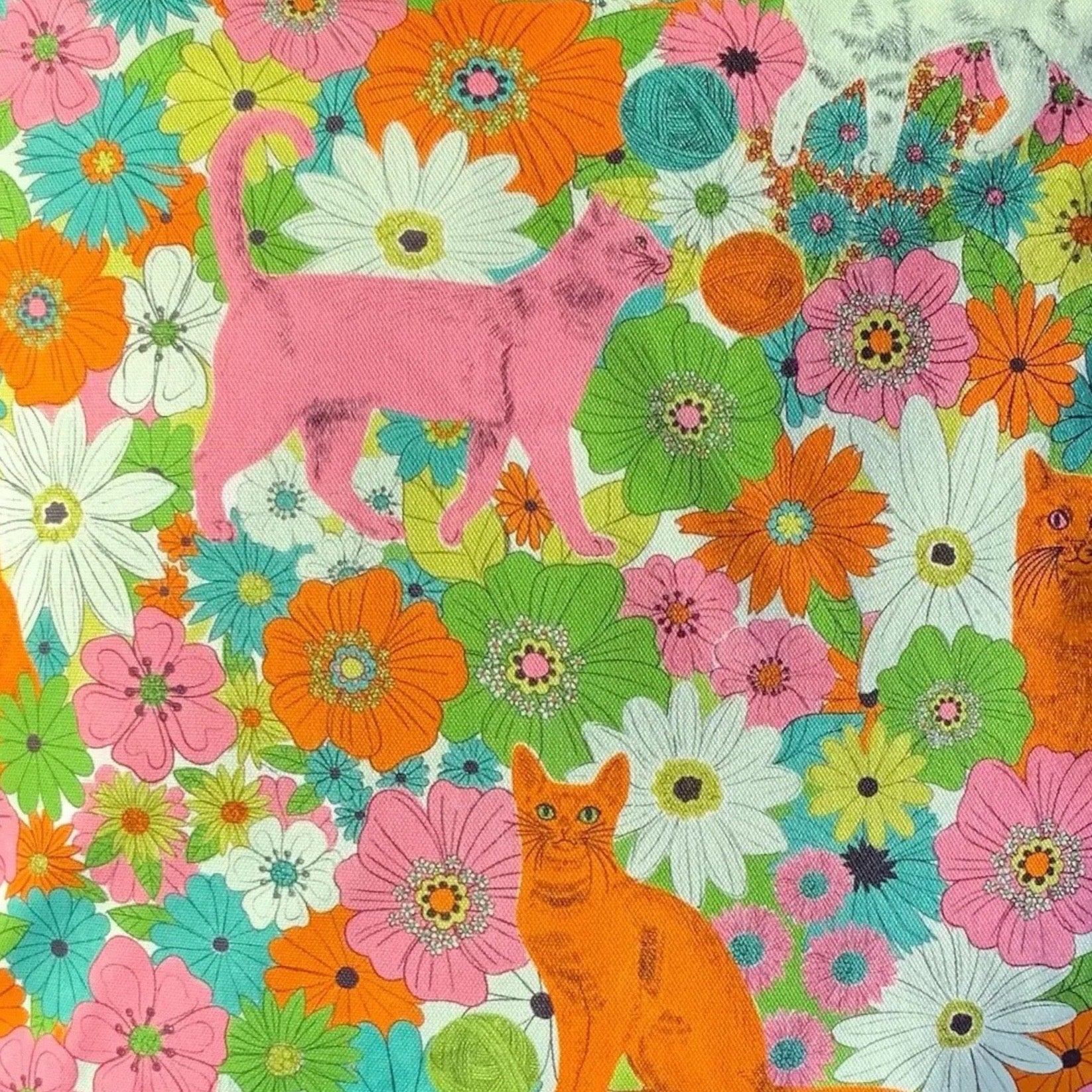 Colourful pattern with cats and flowers.