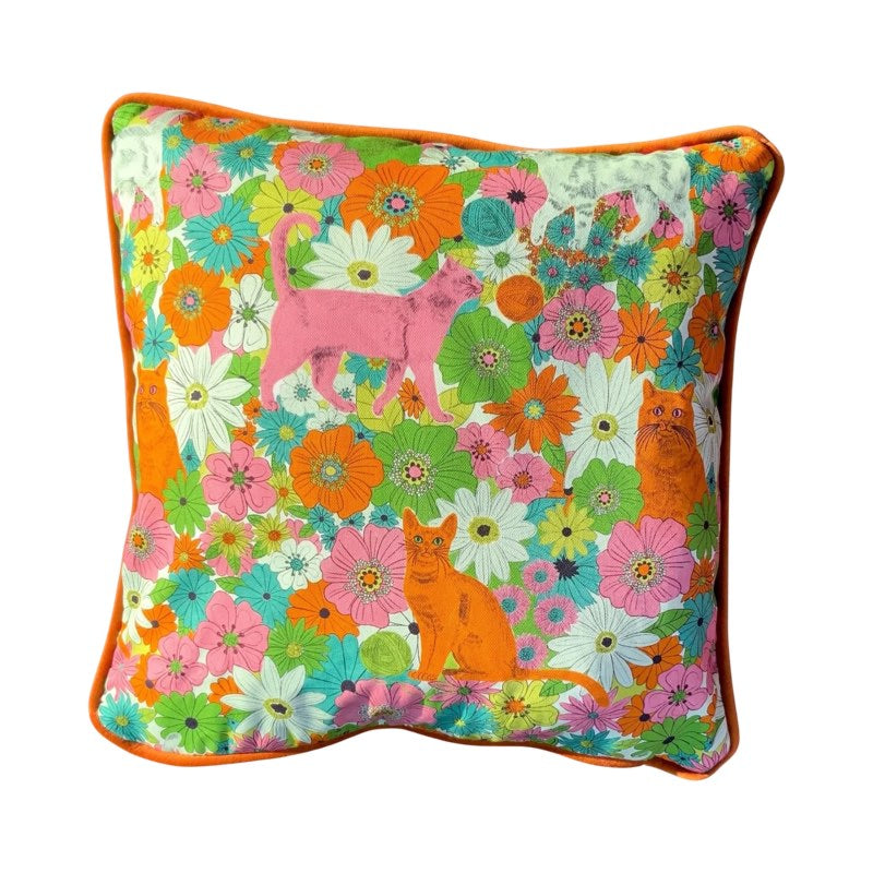 Gorgeous cushion featuring pink, orange and pale green cats hiding in a meadow of flowers.