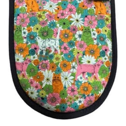 Oven gloves with colouful floral and cat pattern.