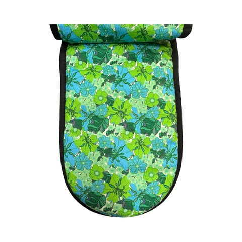 Green flowery inside of oven gloves.