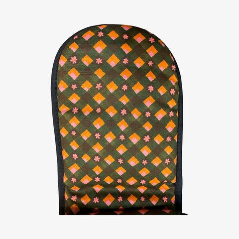 Oven gloves with a repeat pattern illustration of an orange and cream VW campervan against a floral backdrop on the front and a checked pink, orange, green and black patterned reverse.