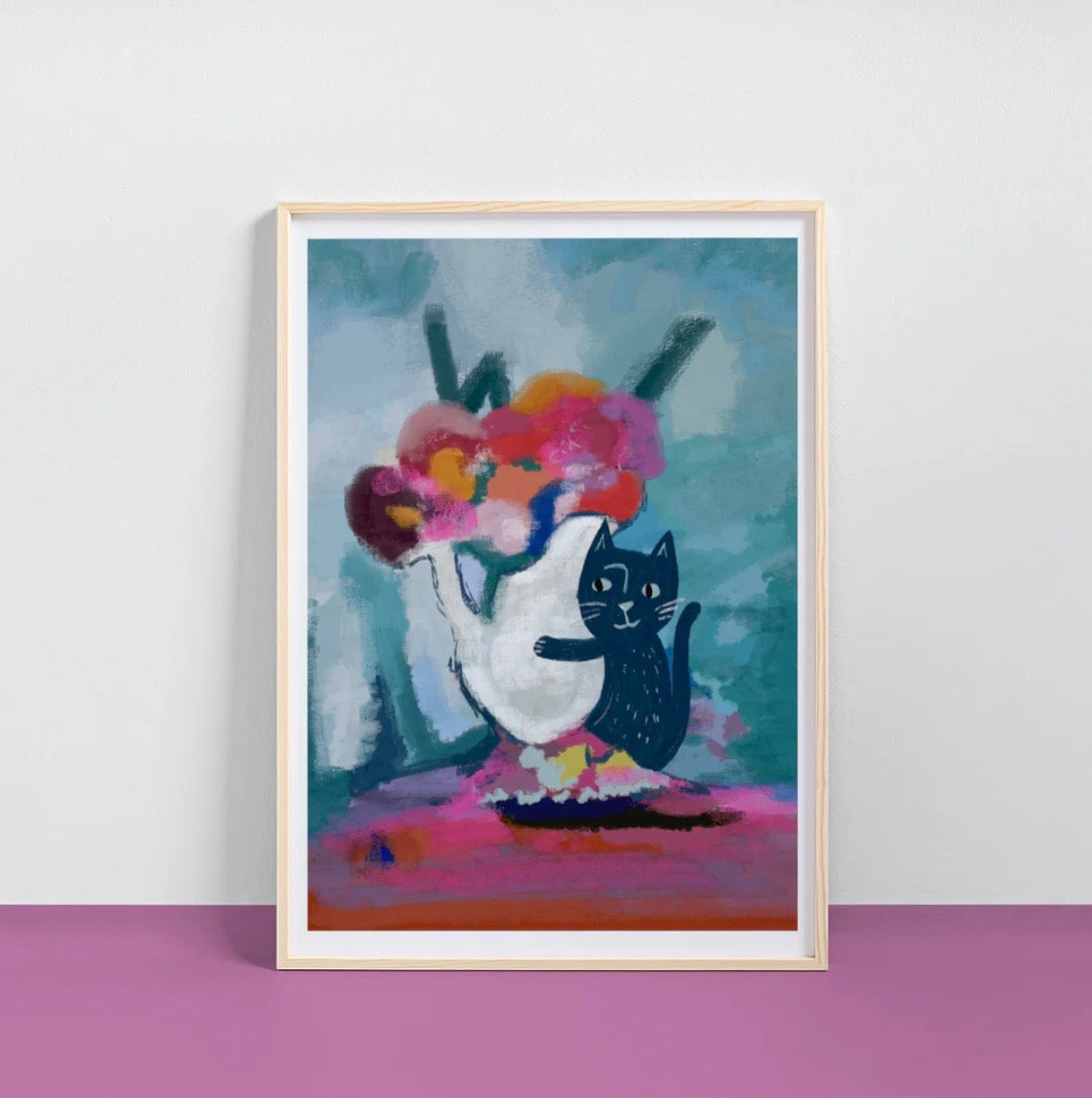 Framed artwork of a cat and vase with flowers on a white wall.