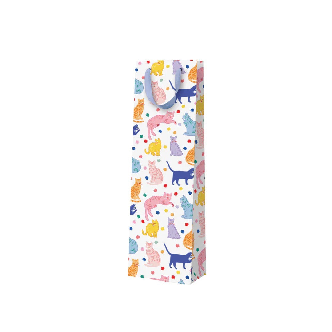 A white bottle bag with multicoloured cats and a lilac ribbon handle.