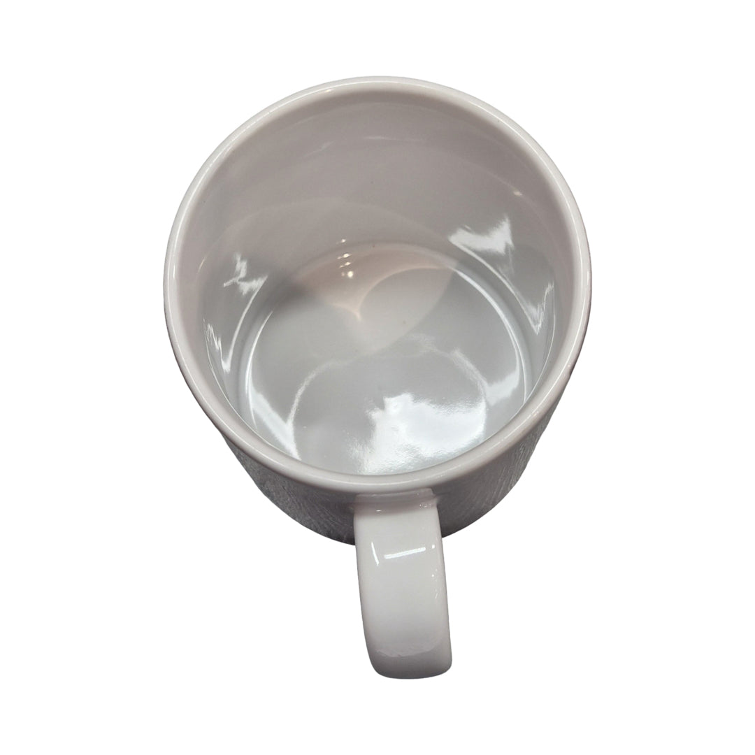 White ceramic mug on a white background