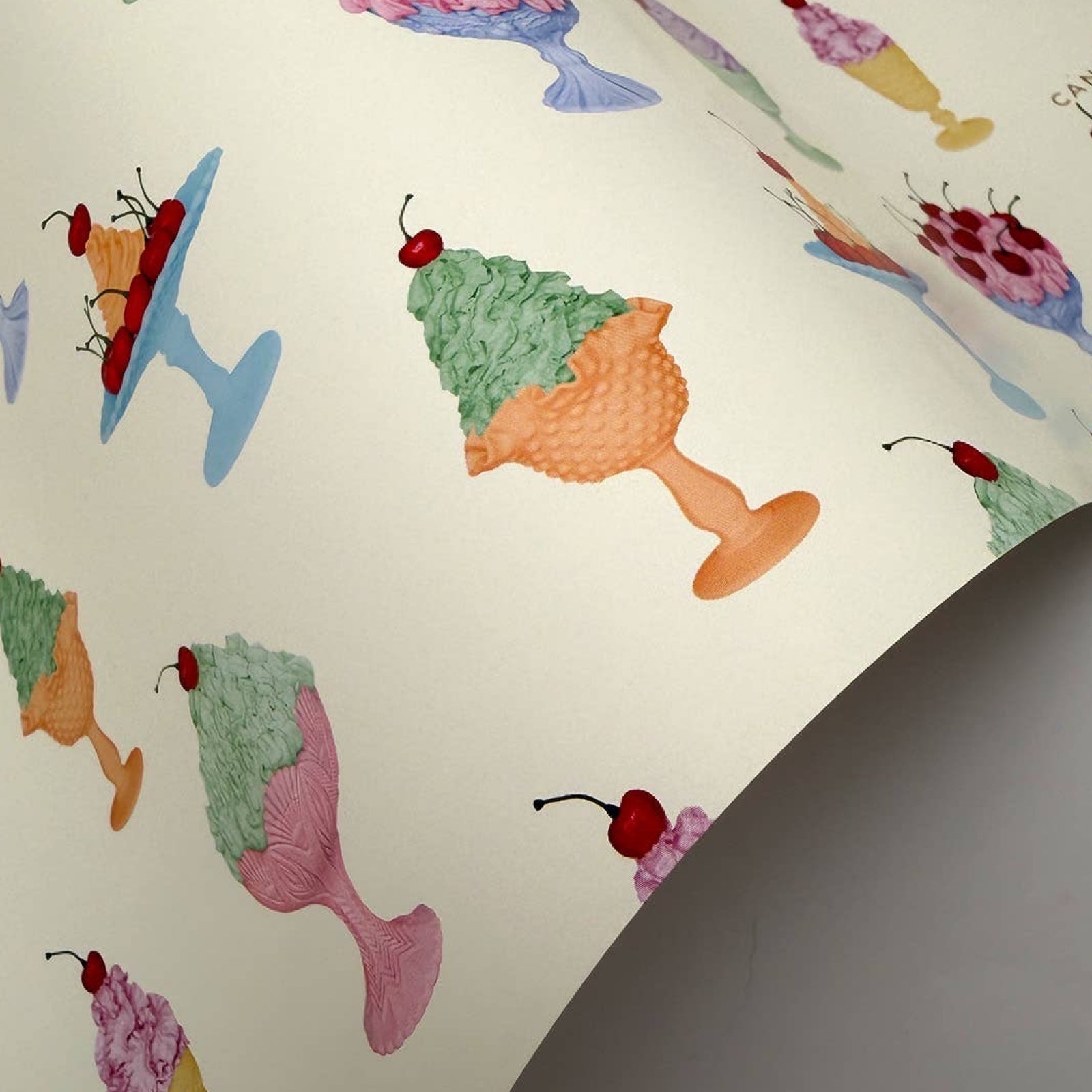 Pattern of colorful chantilly creams with cherries on wrapping paper.