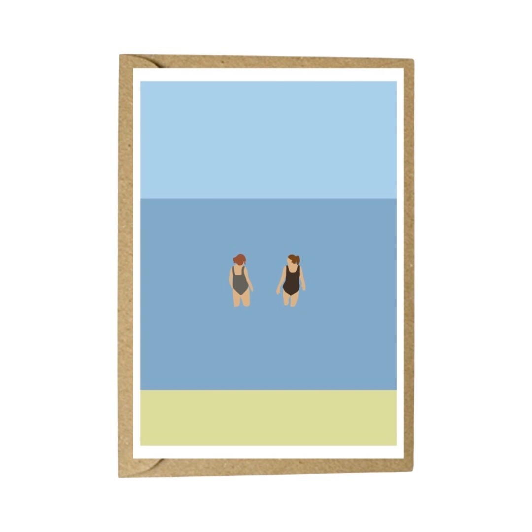 Card featuring two female wild swimmers having a chat in the sea.