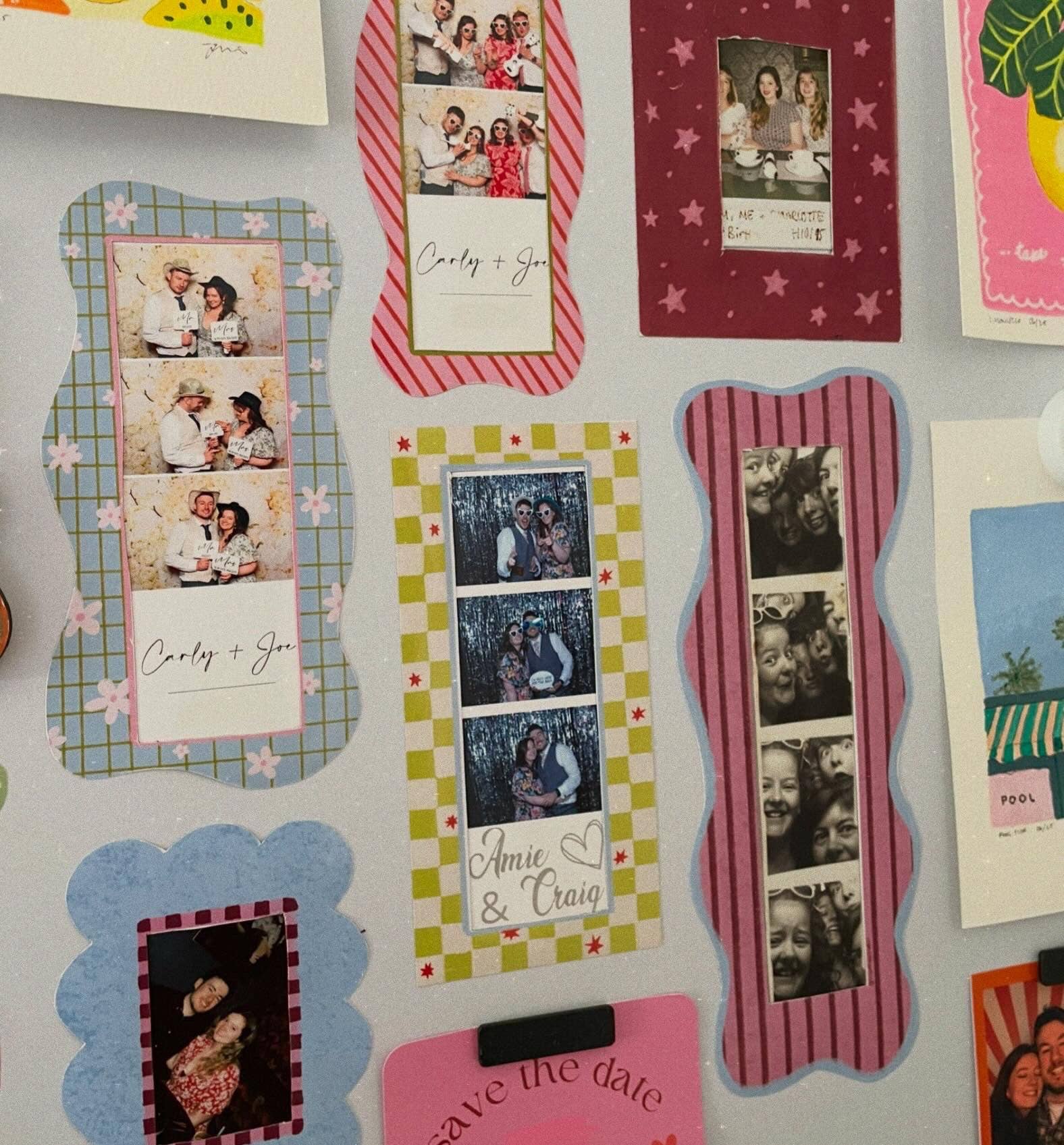 A collection of decorative photo booth tape mounts and custom photo frames displayed on a light grey wall. The designs feature scalloped edges, pink and green stripes, floral patterns, and various photo layouts.