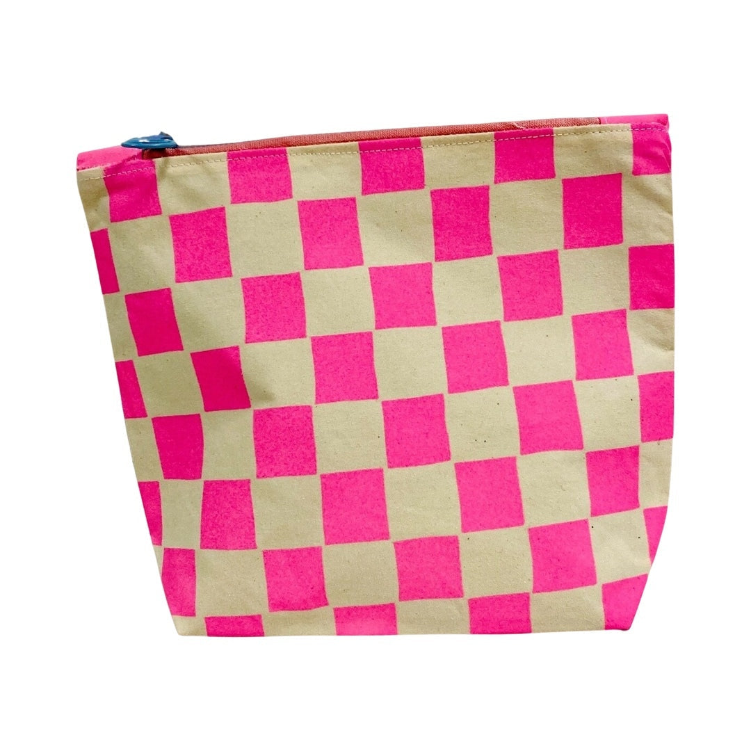 A screen-printed checked cosmetic bag in pink and white.