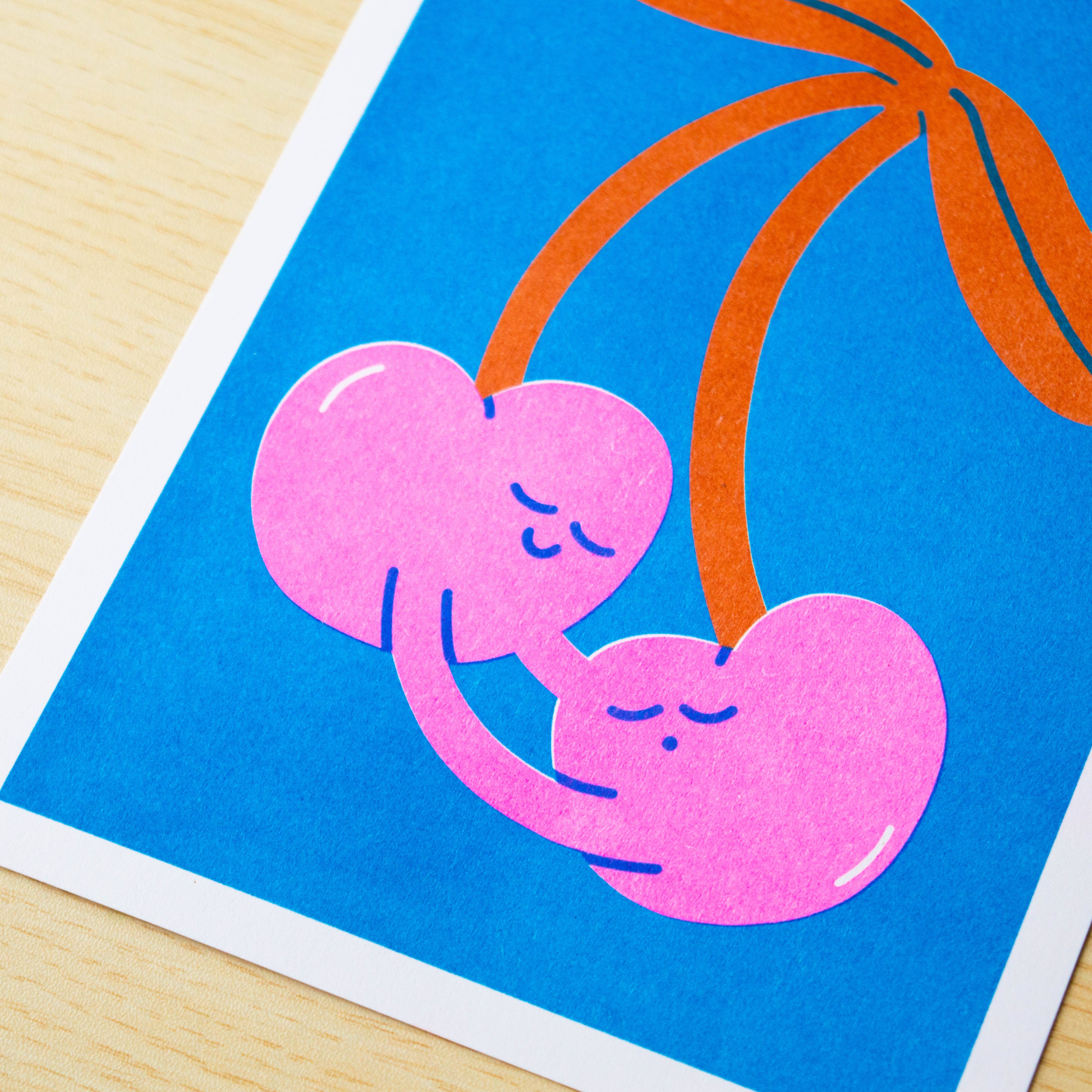 Illustration of pink cherries on a blue background.