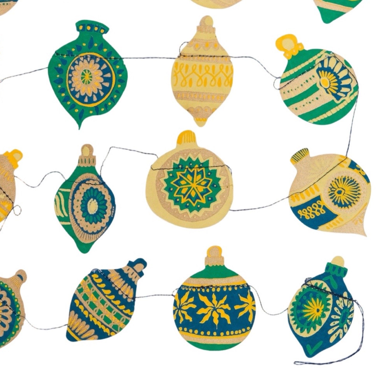 Decorative string lights with green and yellow patterned baubles on a white background.