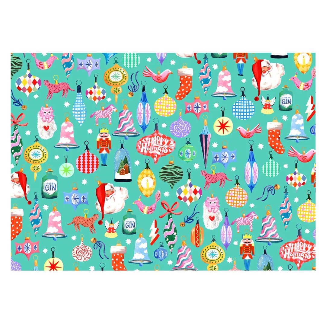 Christmas wrapping paper featuring colourful Christmas baubles on a turquoise background.