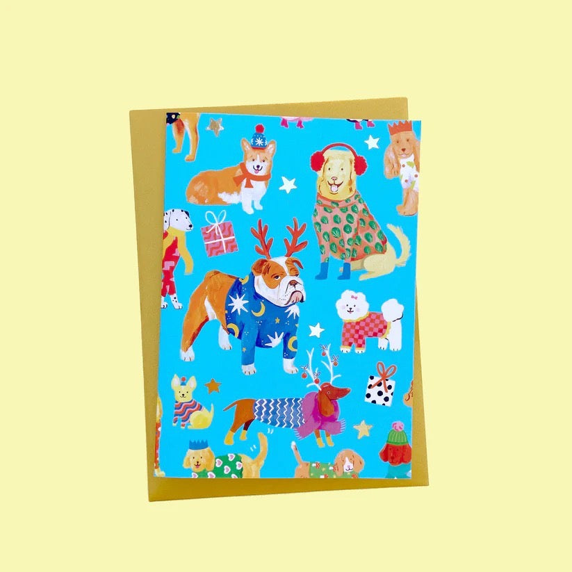 Greeting card with colourful dog illustrations on a blue background.