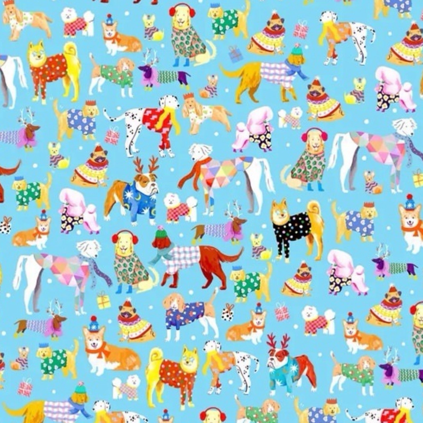 Dogalicious Christmas wrapping paper featuring a selection of festive dogs dressed in woolly jumpers, scarves and ear warmers, all on a blue background with presents and stars.