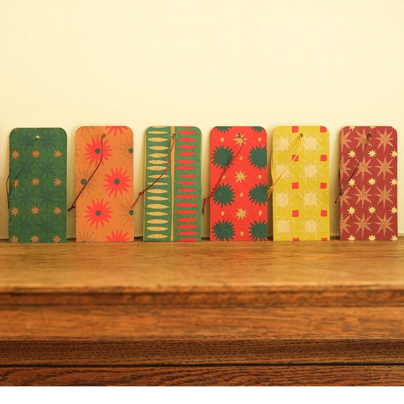 Pack of six screen-printed gift tags. These tags come in a variety of star-shaped patterns and festive colours.