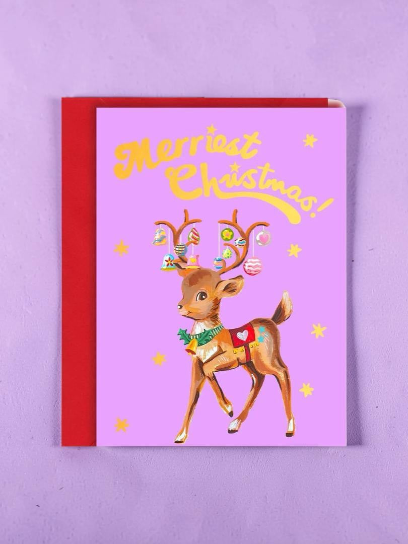 Christmas card with a reindeer illustration and 'Merry Christmas!' text on a purple background.