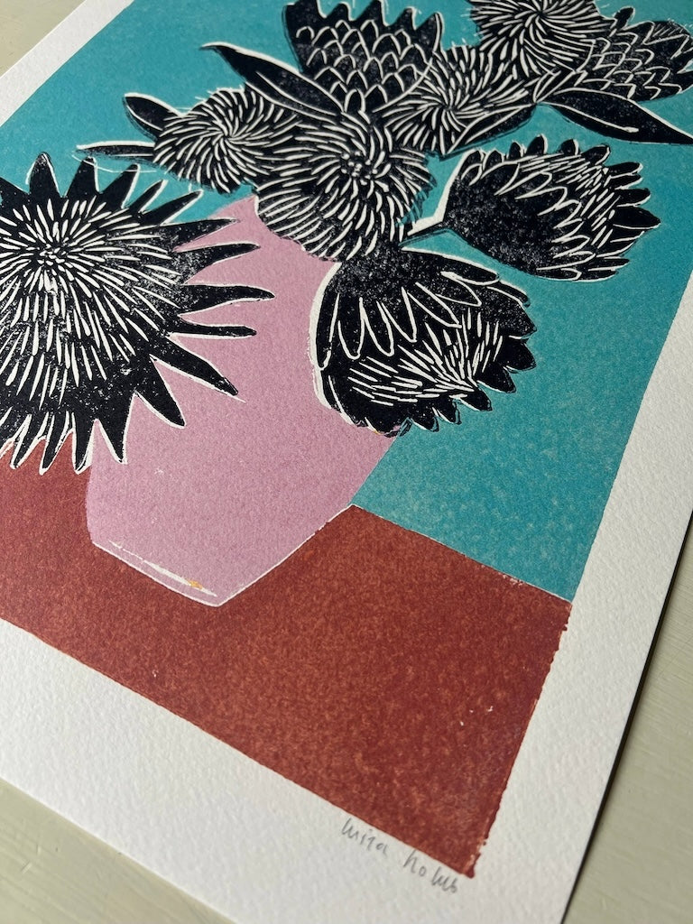 Art print with black floral design on a colourful background.