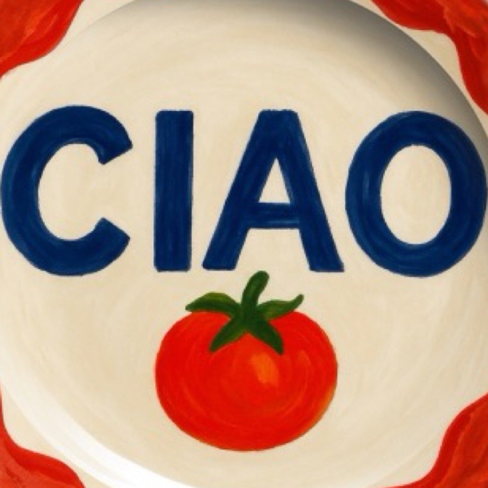 Decorative plate with the word 'CIAO' and tomatoes on a white background.