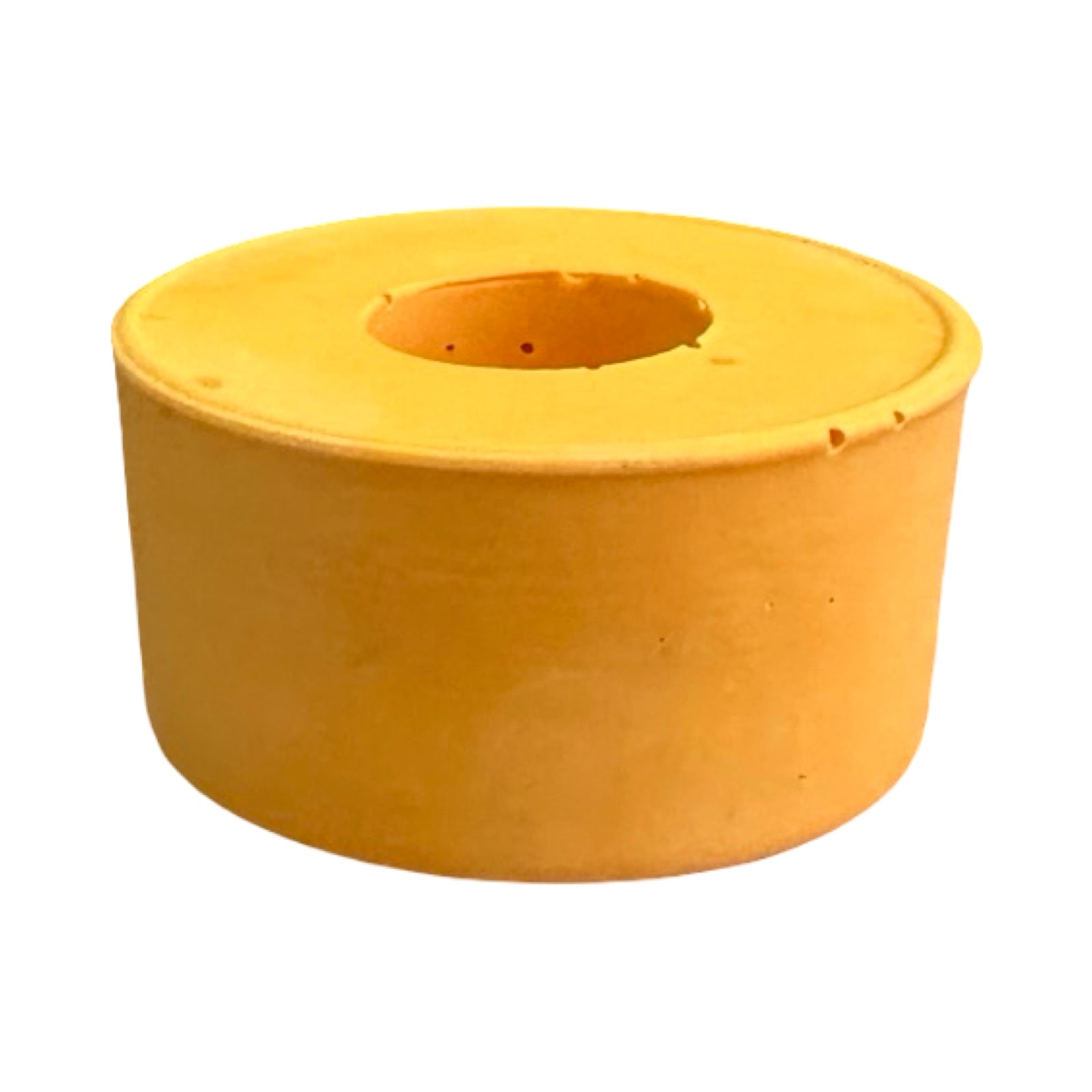 The side of a small circular dinner candle holder in orange.