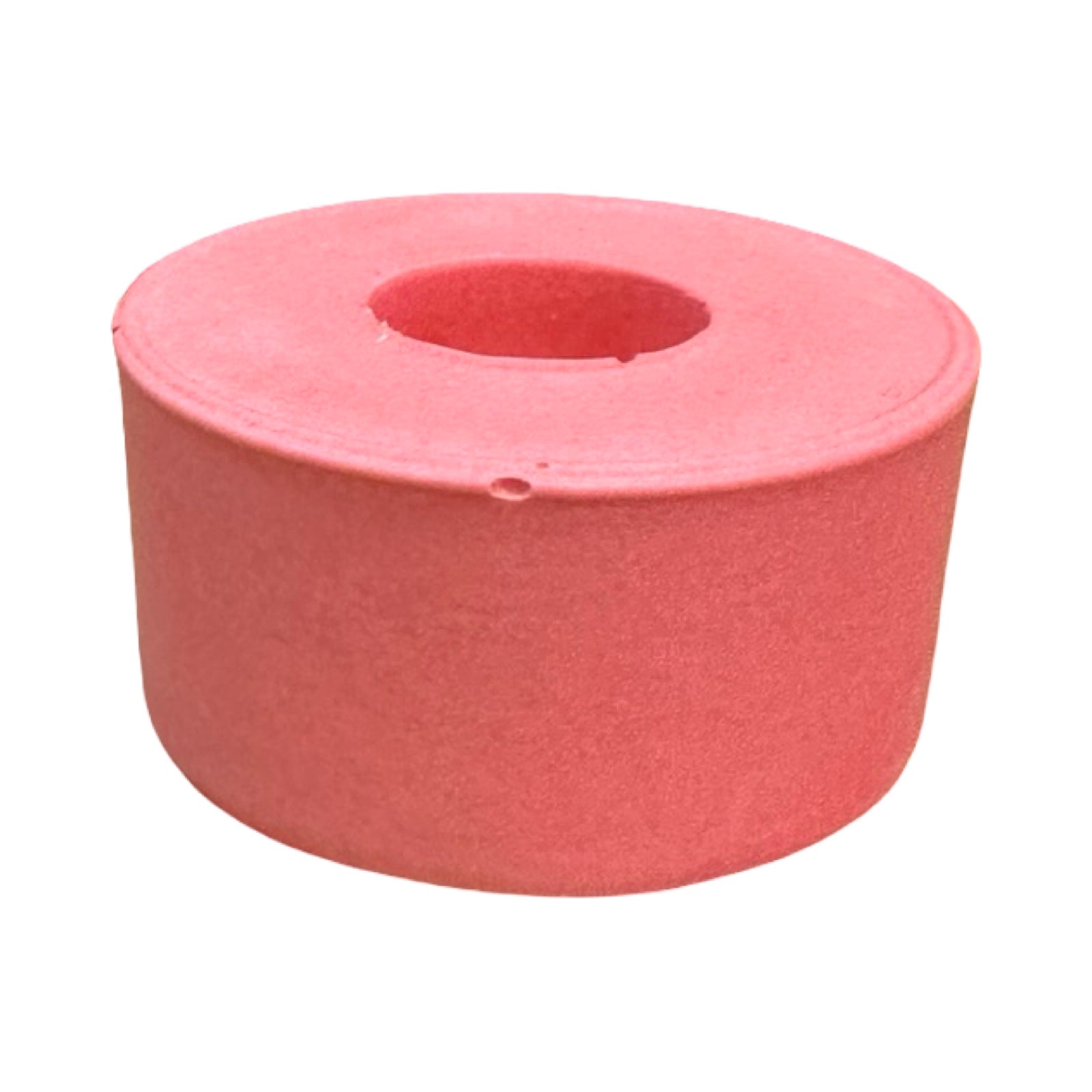 The side of a small circular dinner candle holder in pink.