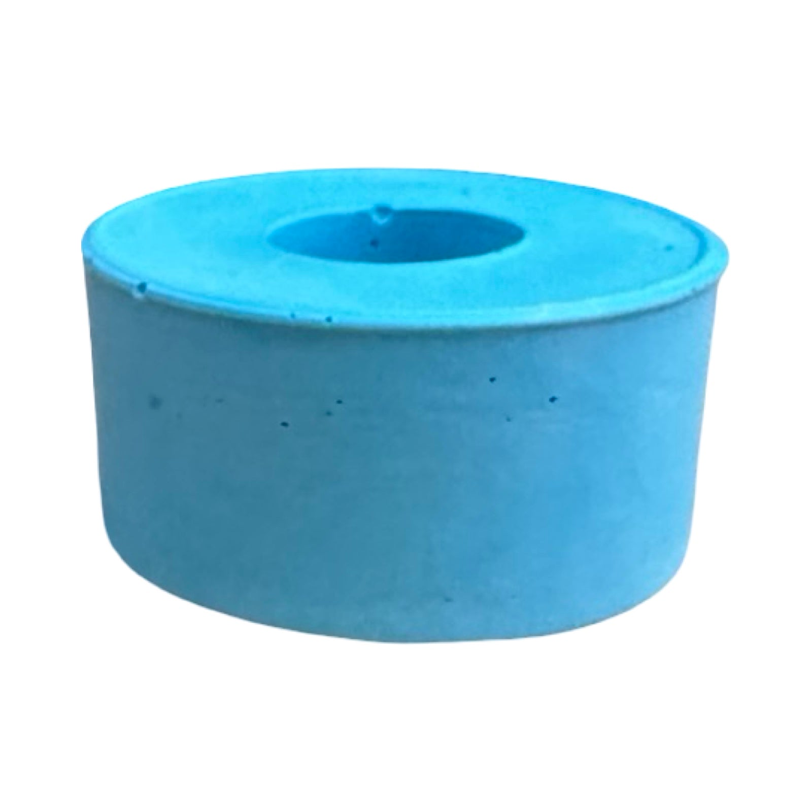 The side of a small circular dinner candle holder in turquoise.