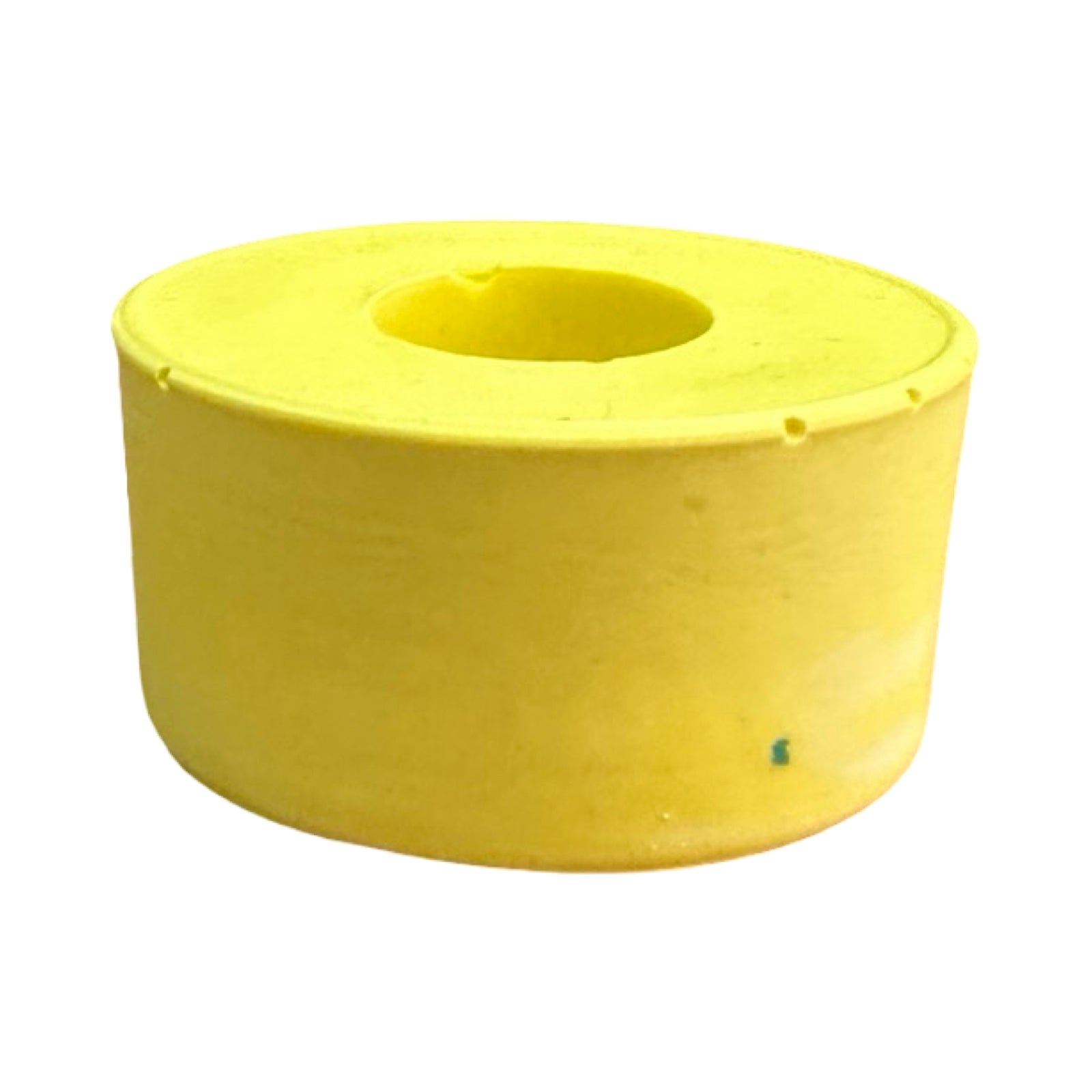 The side of a small circular dinner candle holder in yellow.