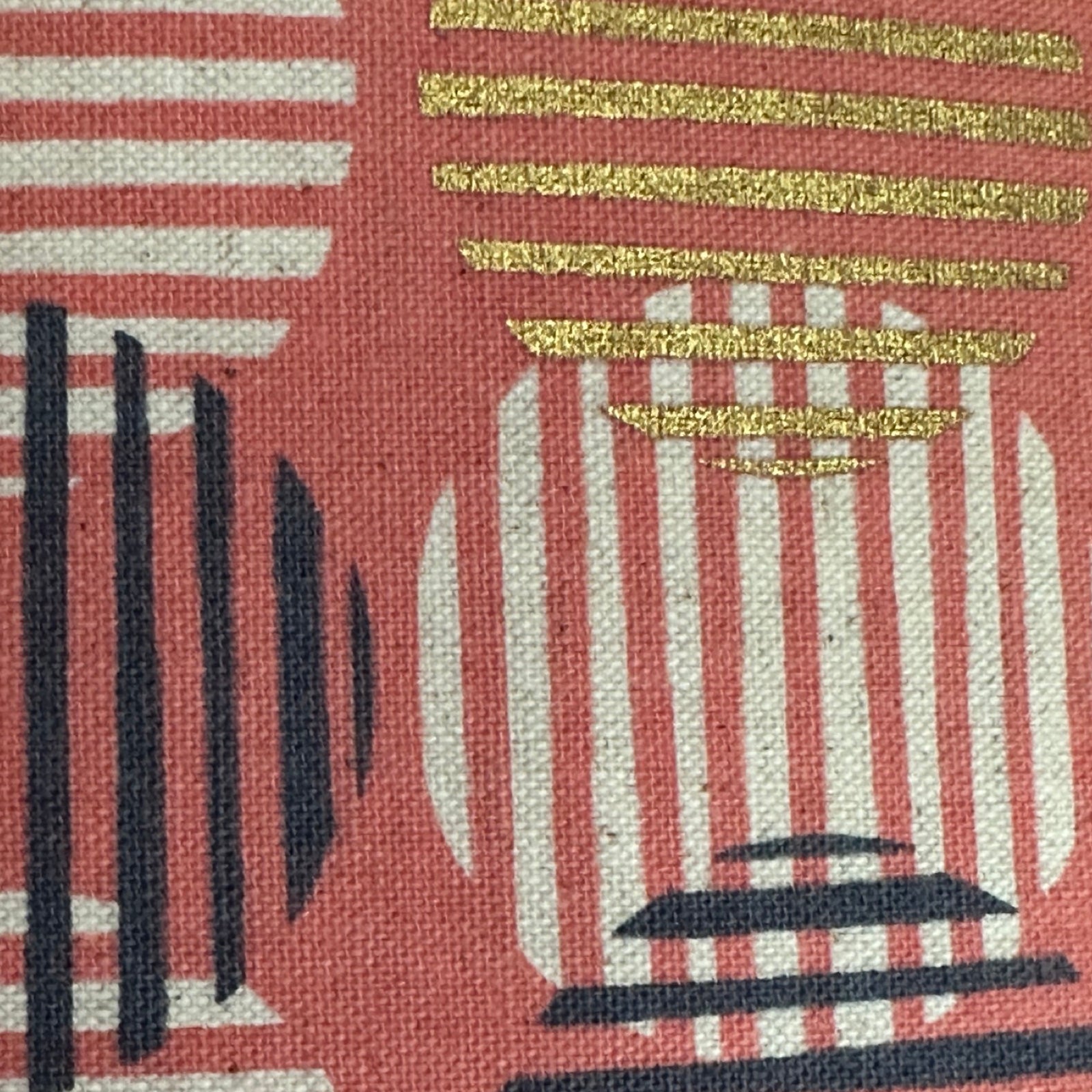 Pink canvas fabric with navy, white, and gold striped circles.