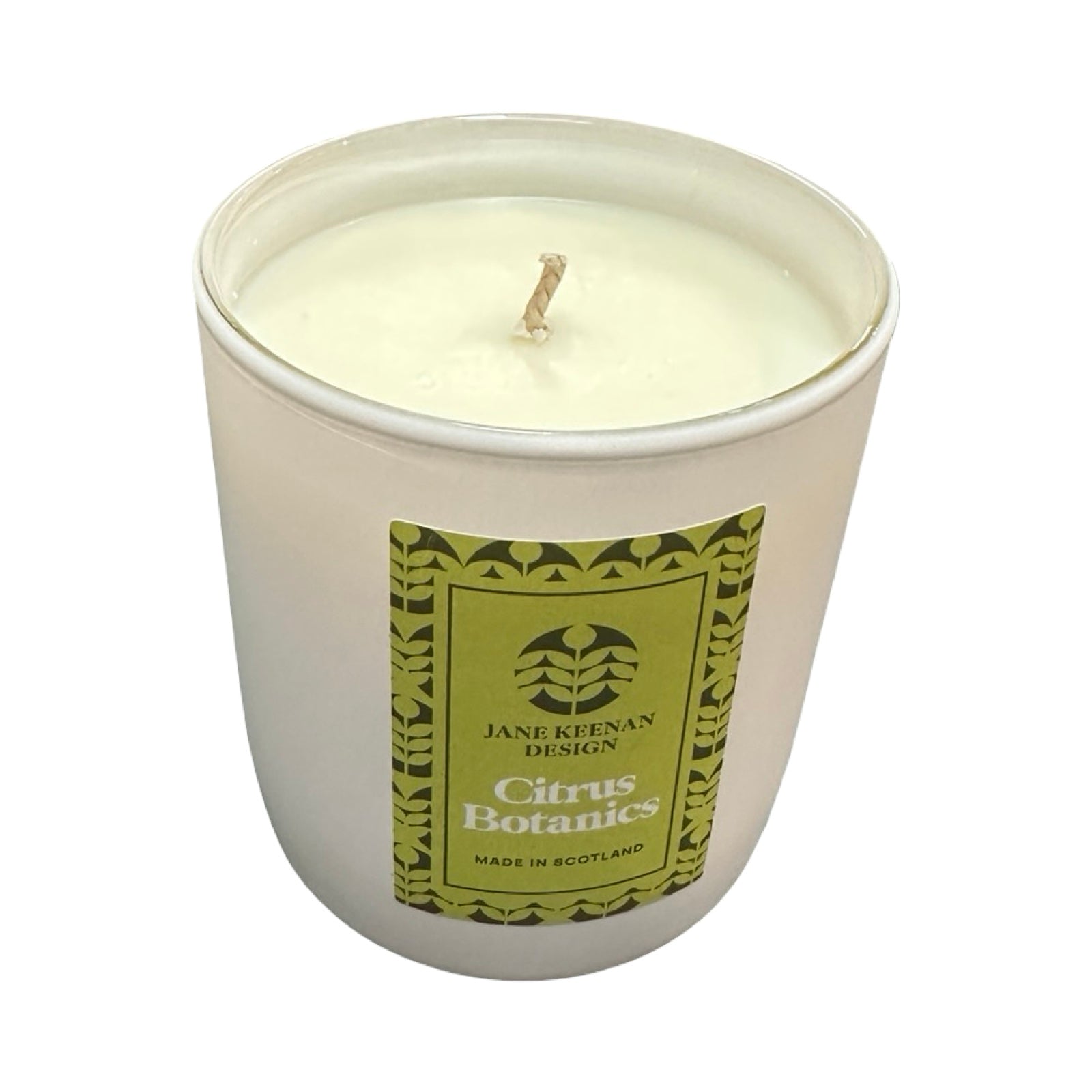Candle in a white container with a green label on a white background.