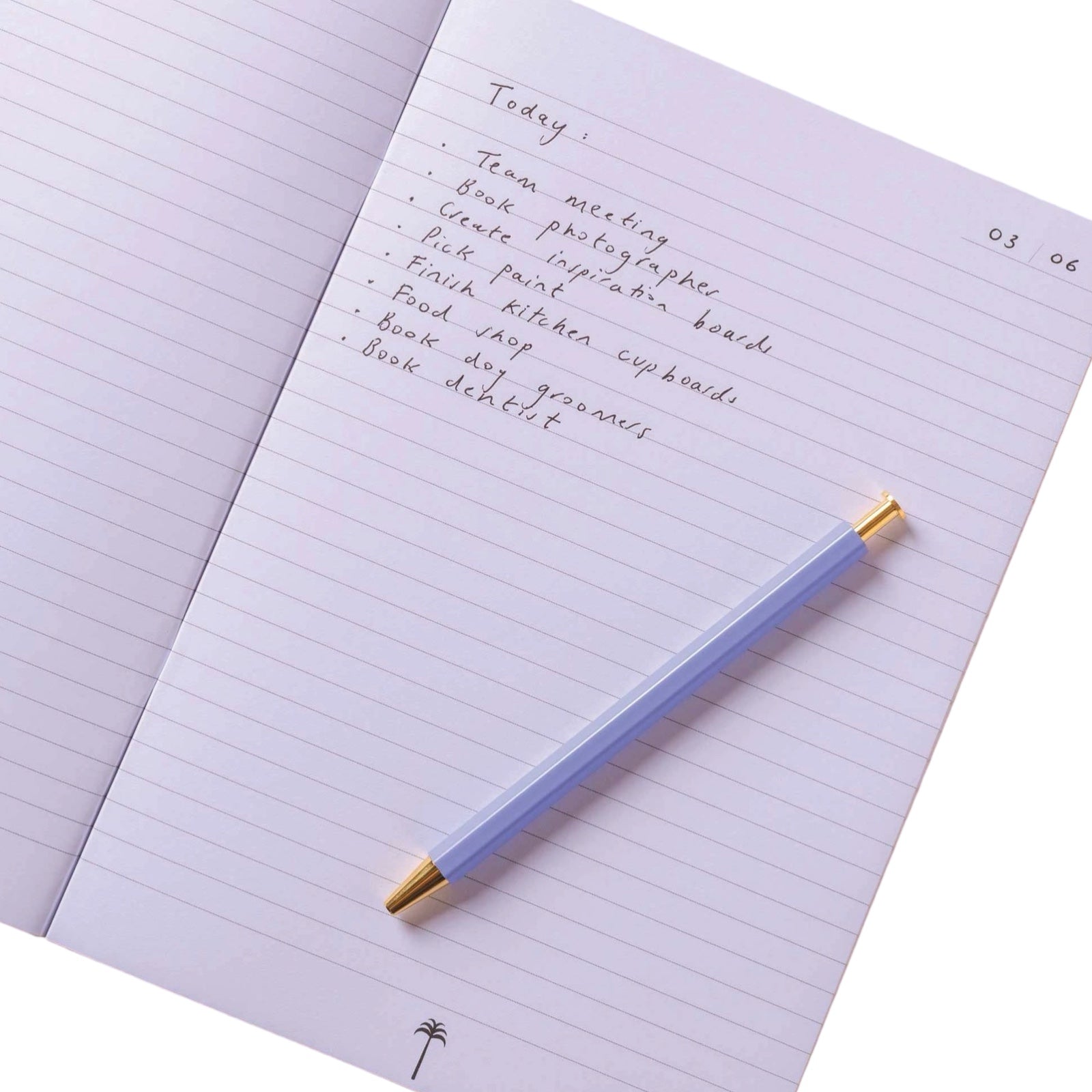 Lined pages of notebook with a pen.