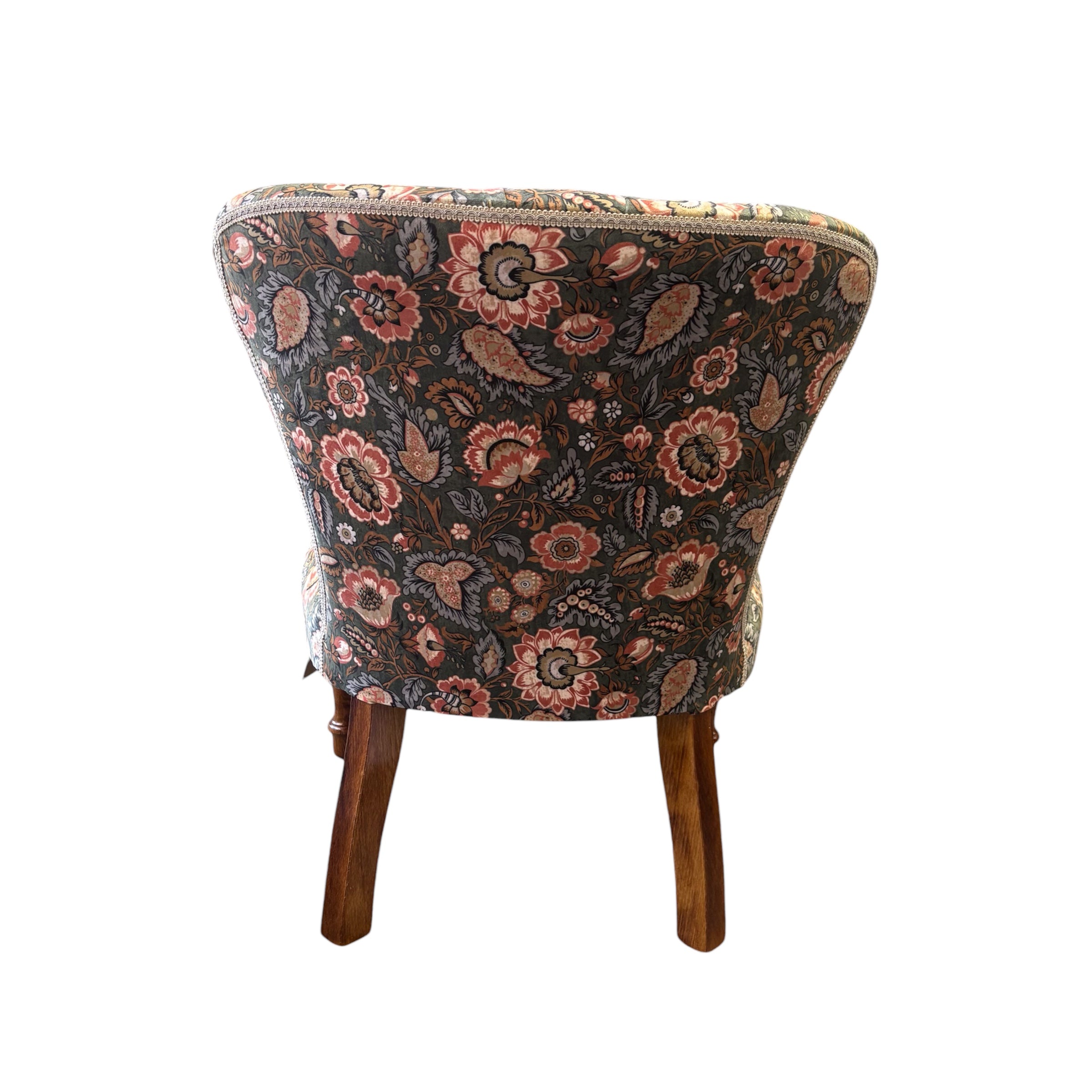 A handmade occasional button-back chair in luxurious light green/grey velvet with coral flowers and pale blue leaves. This chair has a button-back and is finished with cream binding and mahogany stained legs.