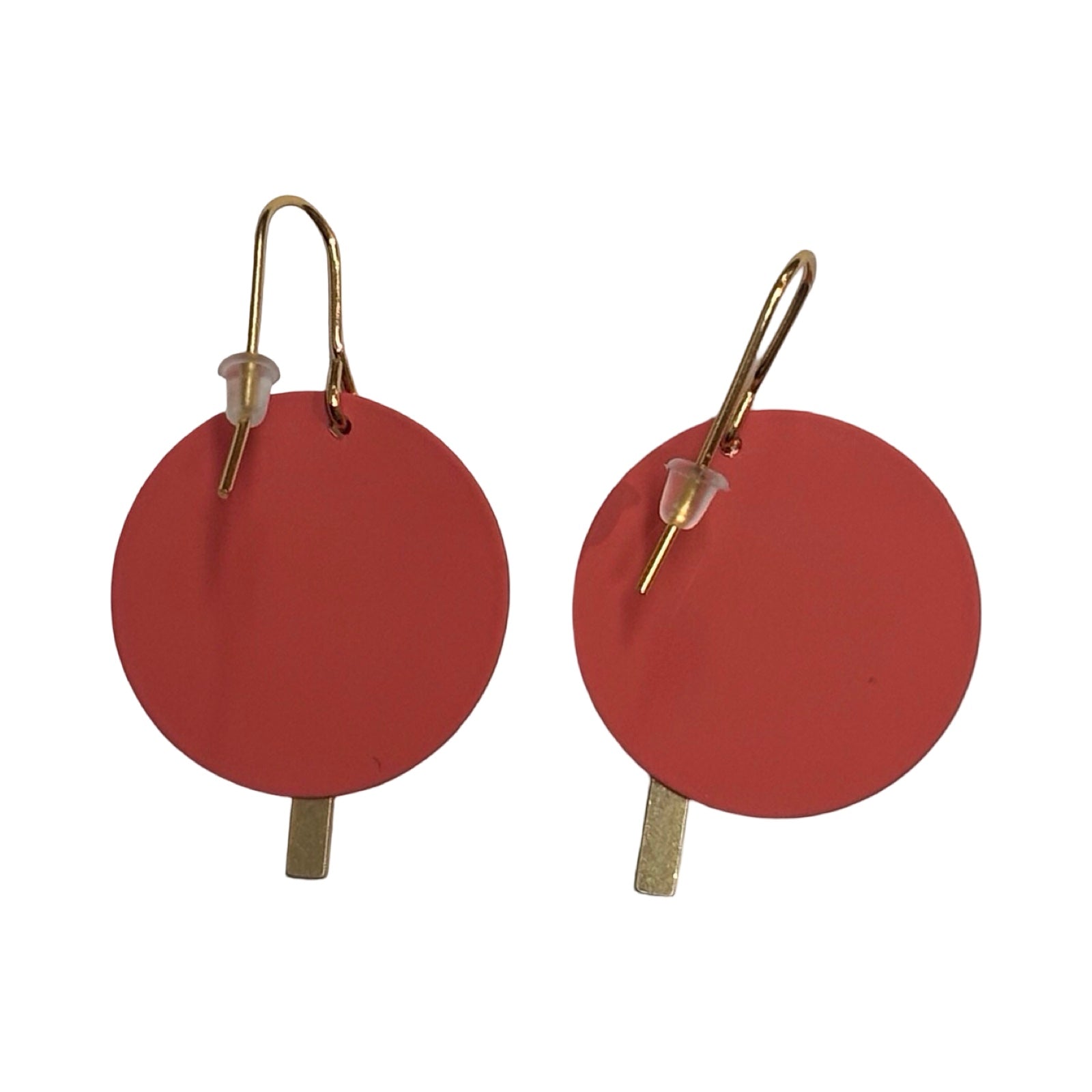 Pair of earrings with red circular discs and gold bars on a white background.