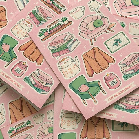 This sticker sheet features 11 individual stickers inspired by dreaming of being curled up, reading your favourite book. The stickers include two stacks of books, a cosy cardigan. and a cup of tea.