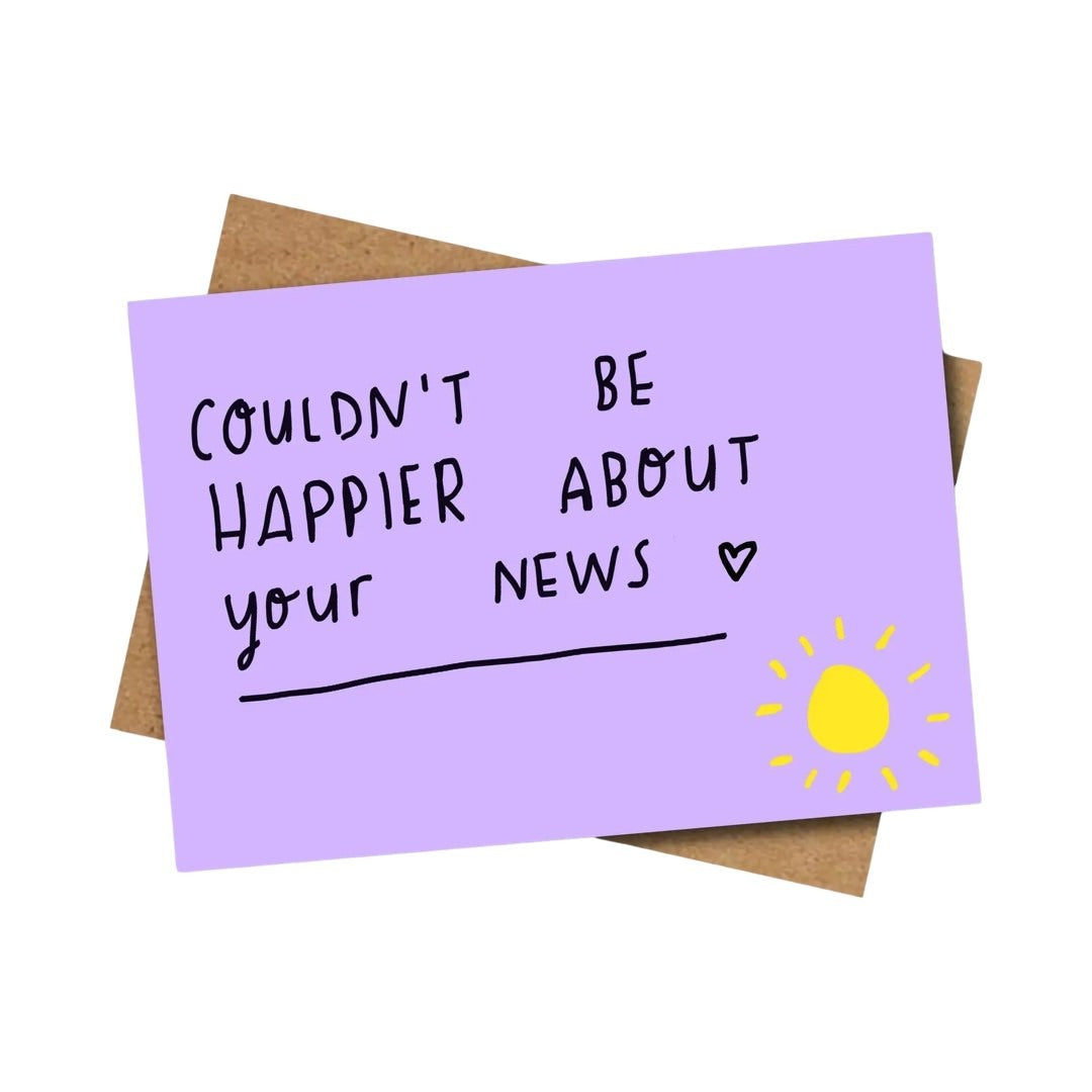 A greeting card with a lilac background, black text that reads 'COULDN'T BE HAPPIER ABOUT YOUR NEWS', and a bright yellow sun in the bottom right corner.