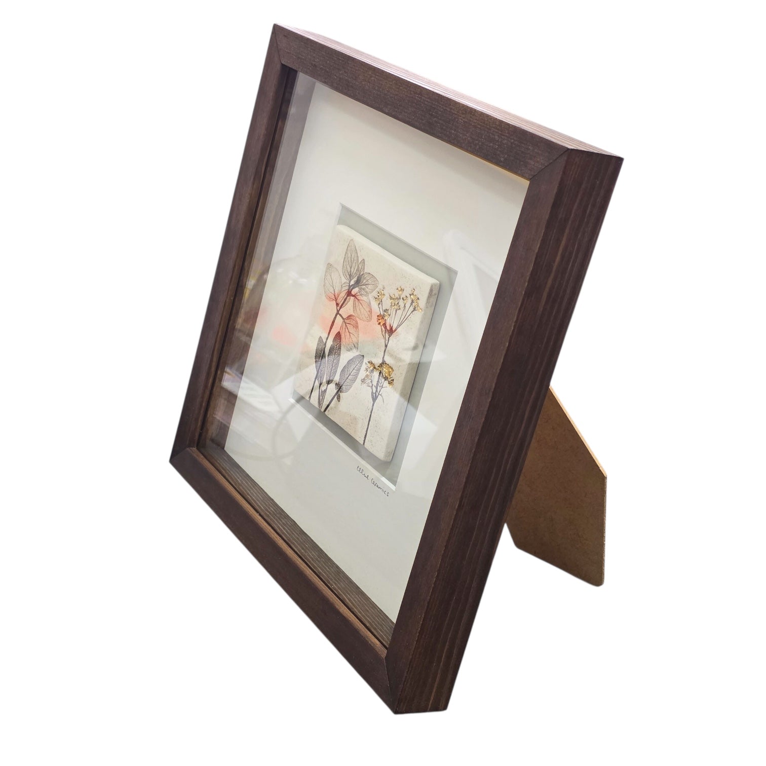 Framed tile featuring cow parsley in a wench frame on a white background