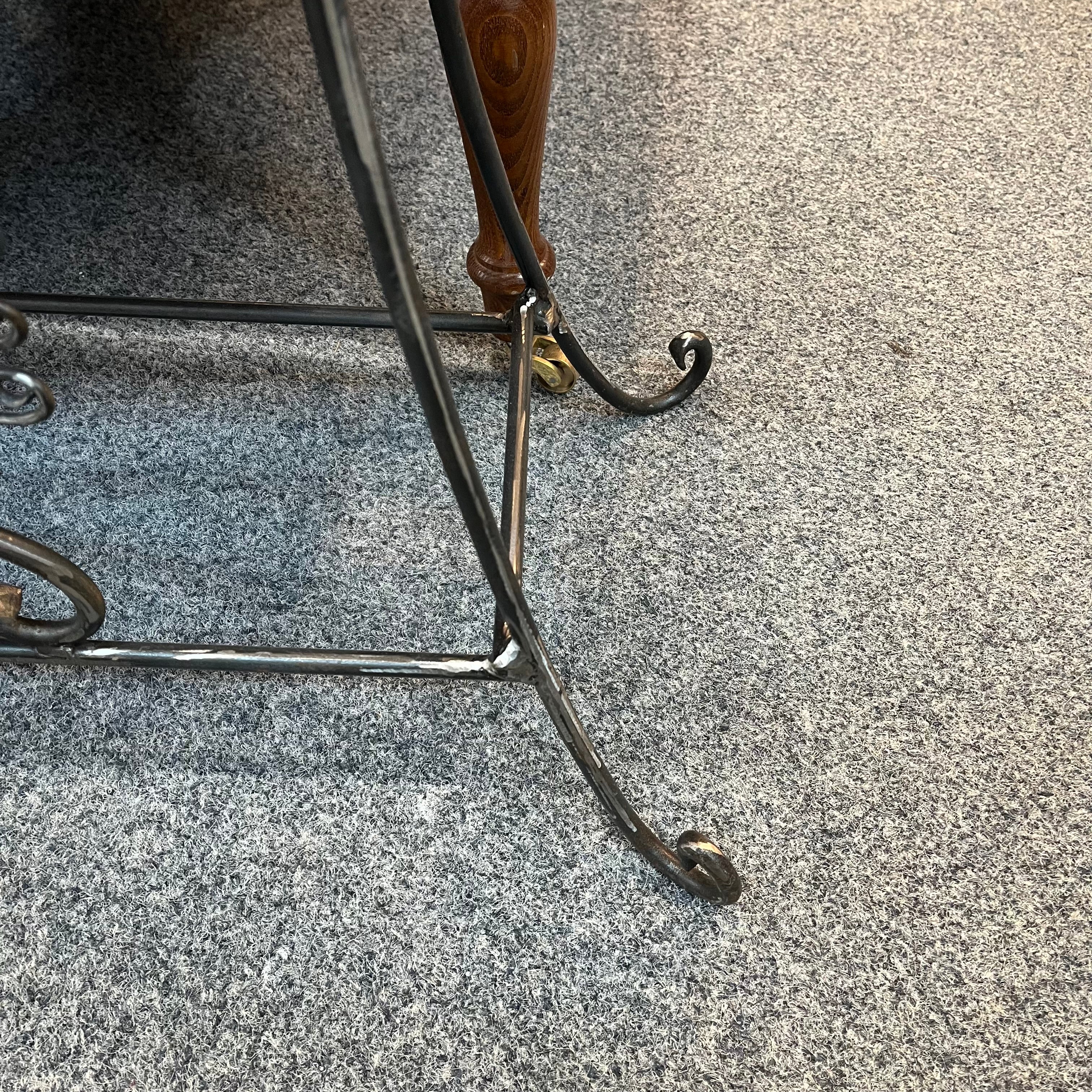 A handmade table/bench with an yew wooden top and a galvanised steel frame with a cow parsley design. Suitable for indoor or outdoor use. (Galvanised steel will dull as it weathers, but it won't rust).