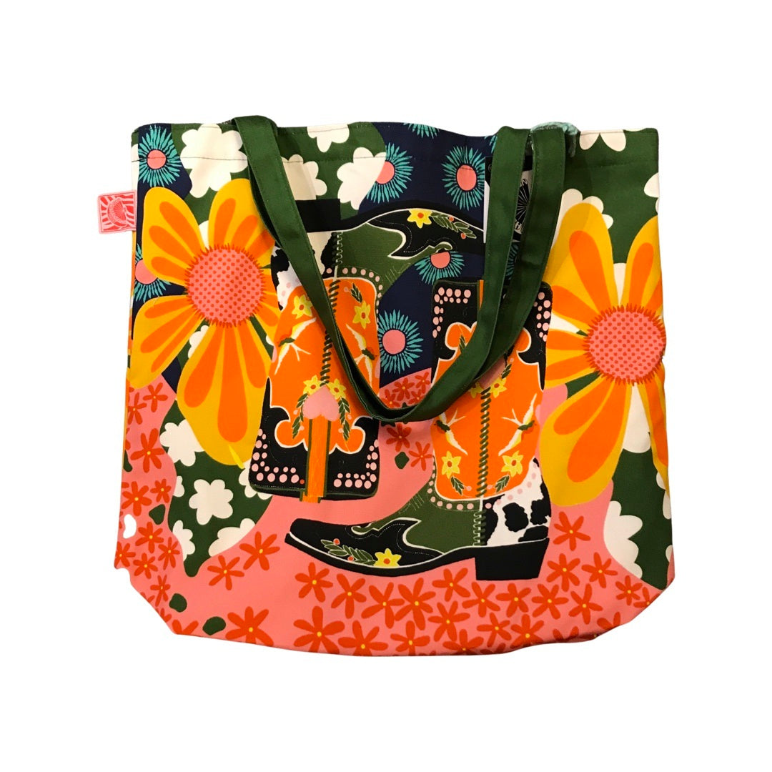 A bright and colourful cowboy boot tote bag.