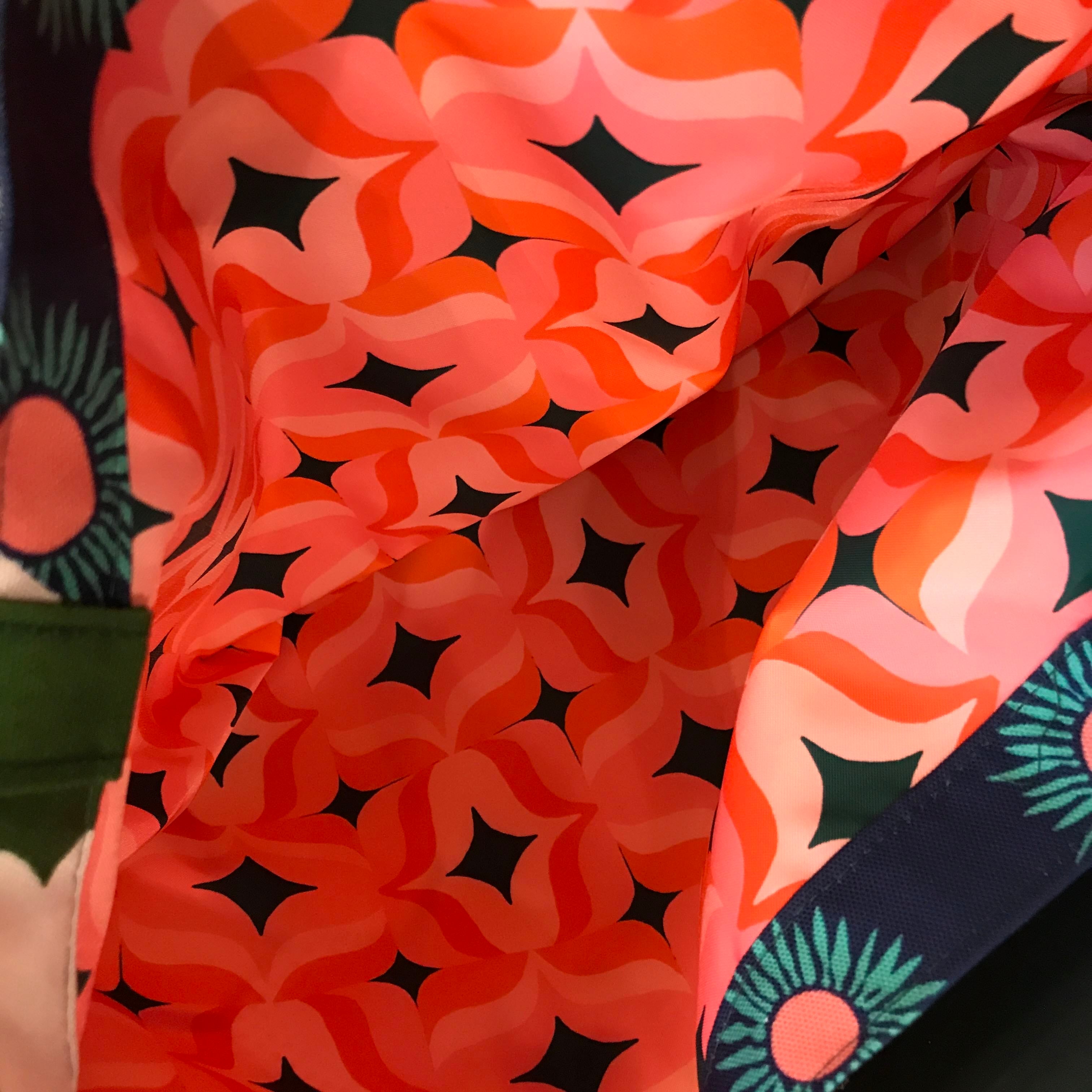 Pink retro patterned waterproof lining.