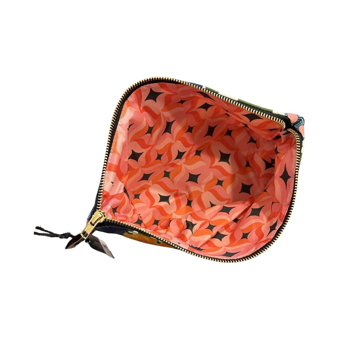 Pink, red and black patterned waterproof lining of cowboy boot zip bag.