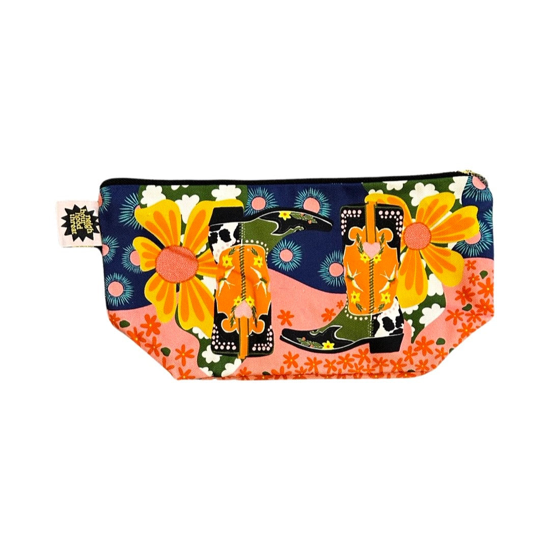 Large zip pouch in fabulous cowboy boot fabric with a pink, red and black patterned waterproof lining.
