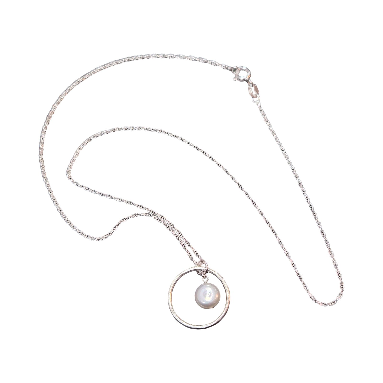 Silver necklace with a pendant featuring a pearl on a white background.