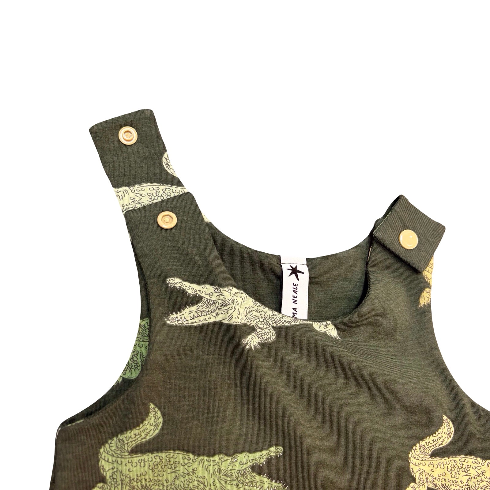 Children's green romper with alligator pattern on a white background.