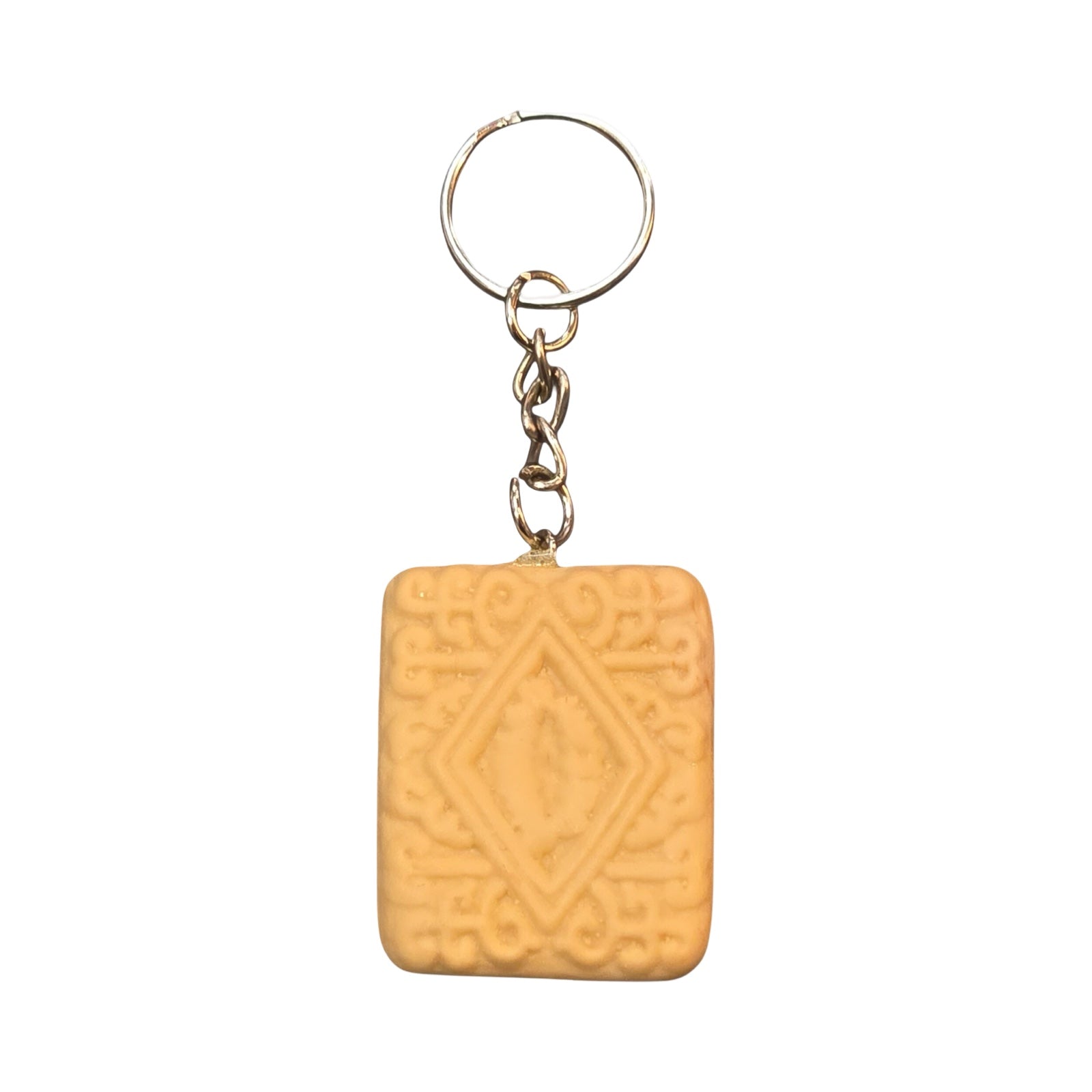 A fun keyring in the shape of a custard cream biscuit, made from polymer clay.