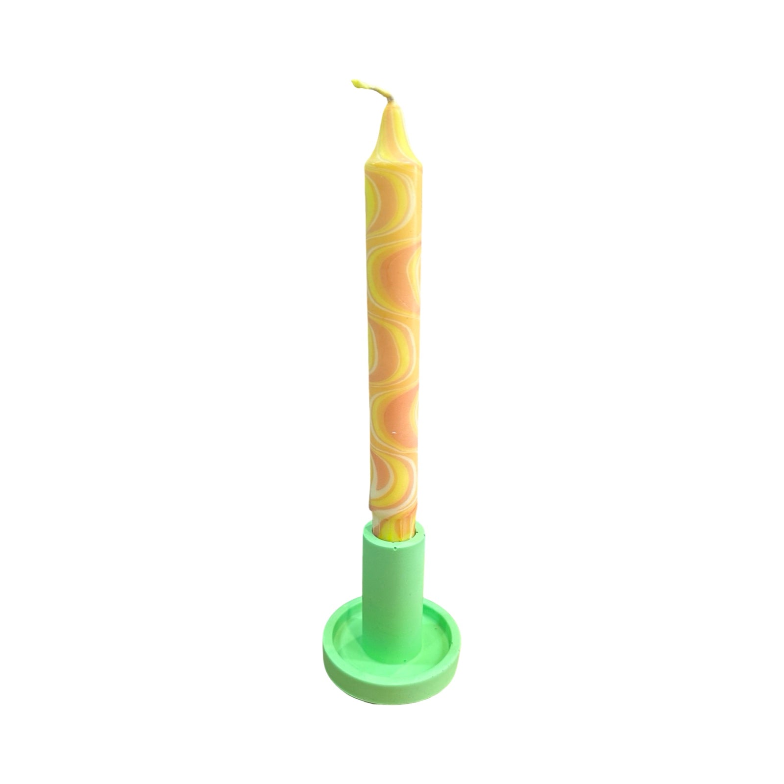 A green cylindrical dinner candle holder with a lip around the bottom to catch any drips holding a yellow and orange zig zag dinner candle.