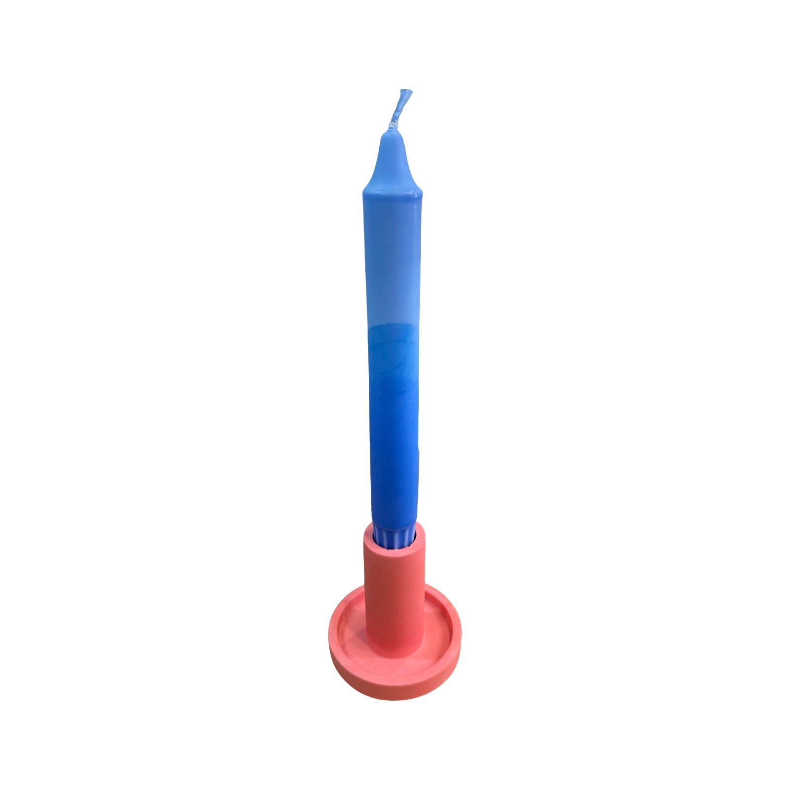 A pink cylindrical dinner candle holder with a lip around the bottom to catch any drips holding a blue dinner candle.