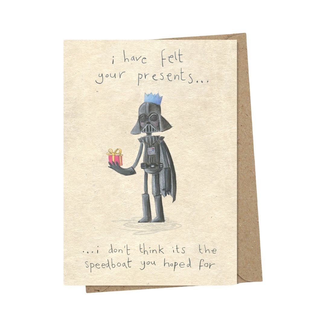 Christmas card with Darth Vadar holding a present, with the text "I have felt your presents... I don't think its the speedboat you hoped for"