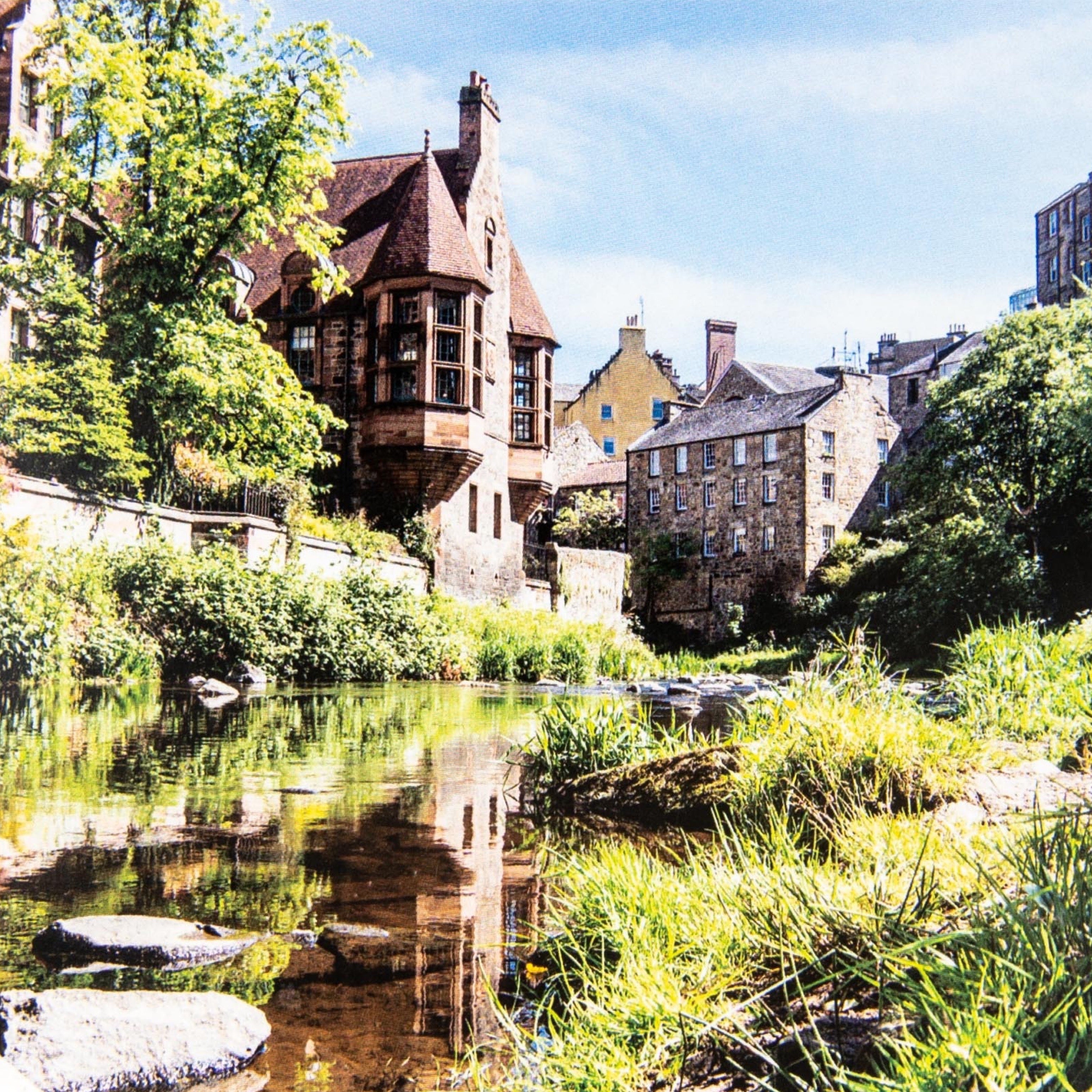 An A6 greeting card featuring a photograph of Dean Village, Edinburgh in summer.