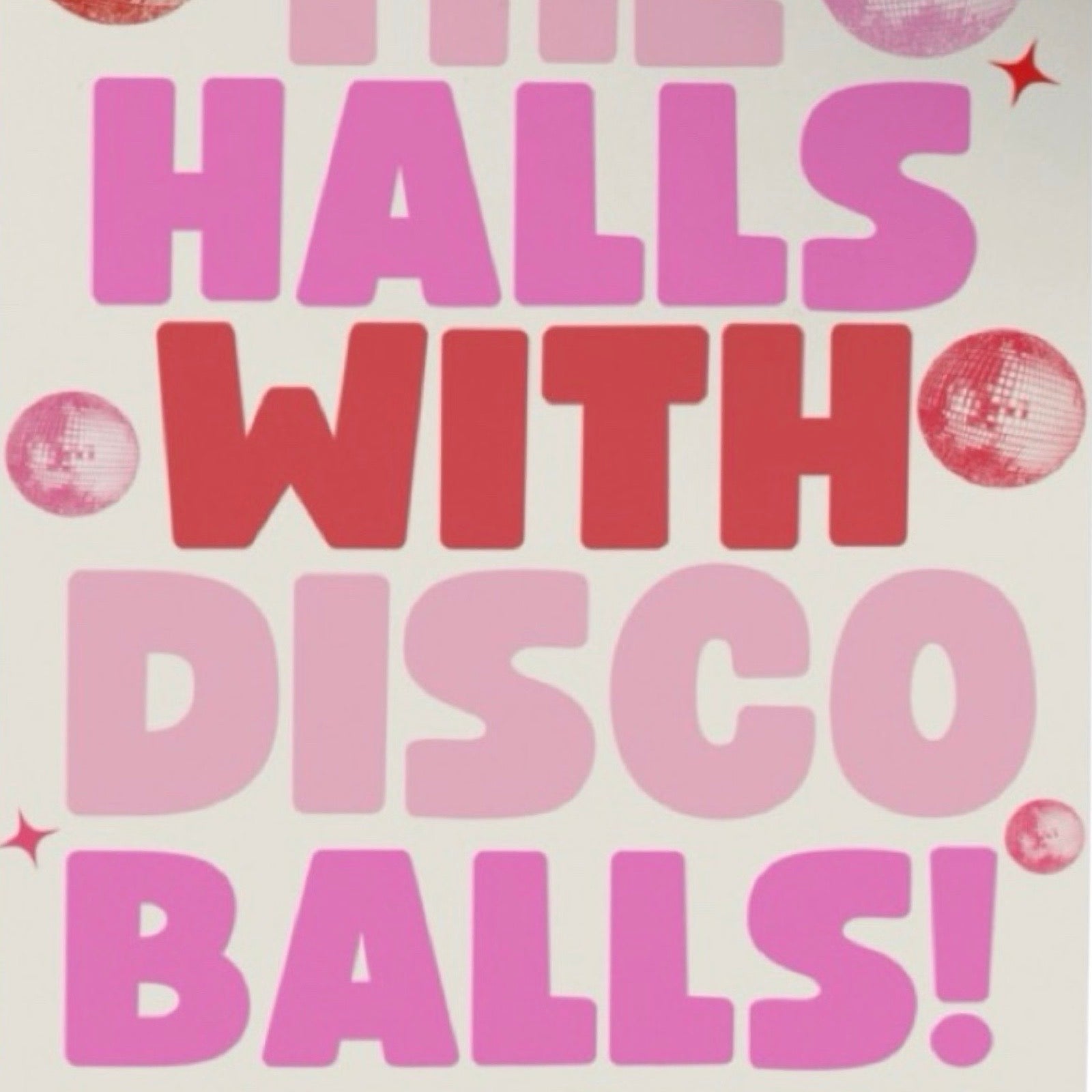This Christmas card features the text 'Deck the Halls with Disco Balls' in red and pink lettering surrounded by red and pink disco balls all on a white background.