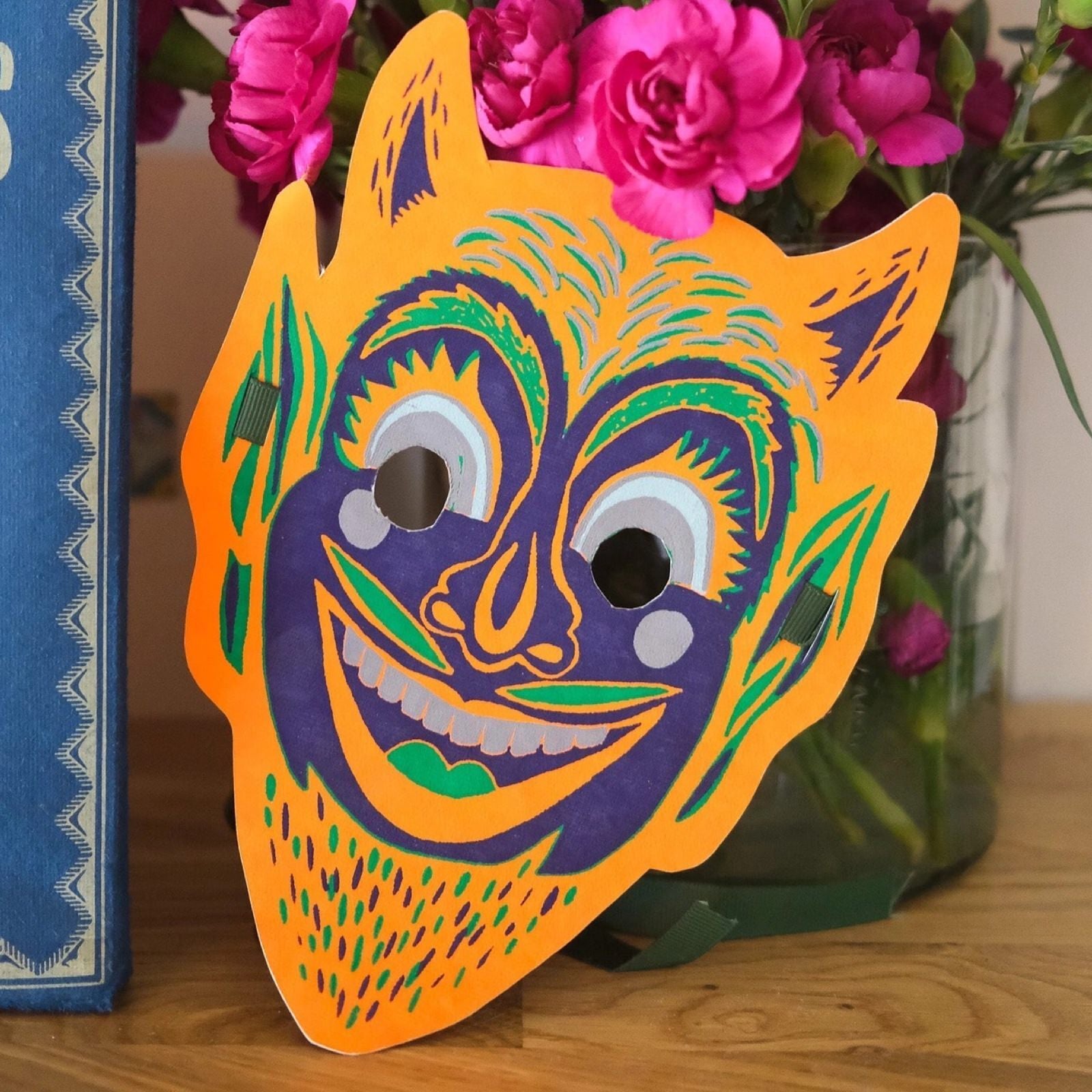 Orange and purple devil halloween face mask.