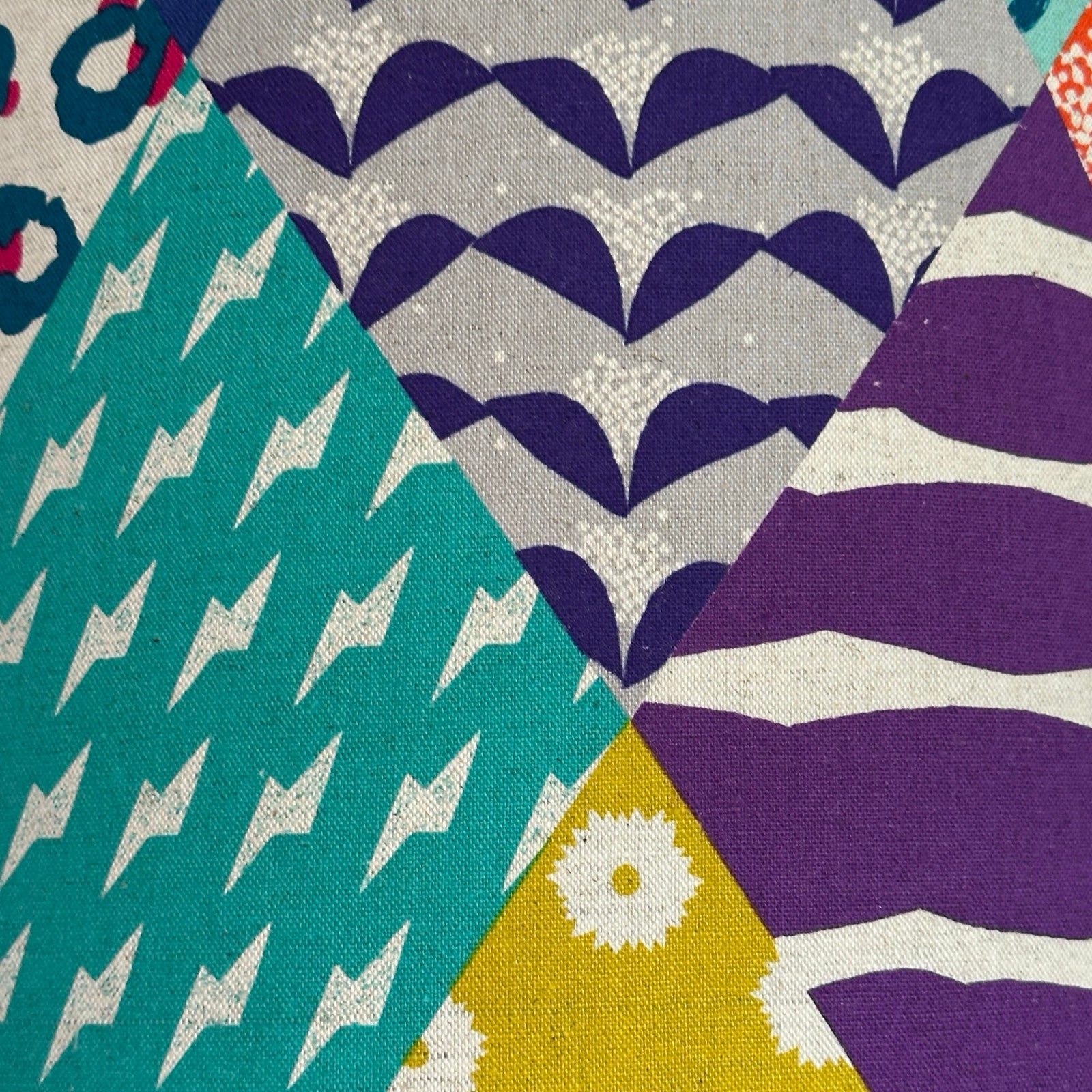 Colourful geometric patterned lampshade.