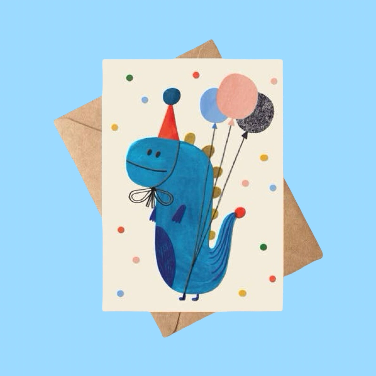Card with a blue dinosaur holding balloons on a brown envelope, on a blue background.