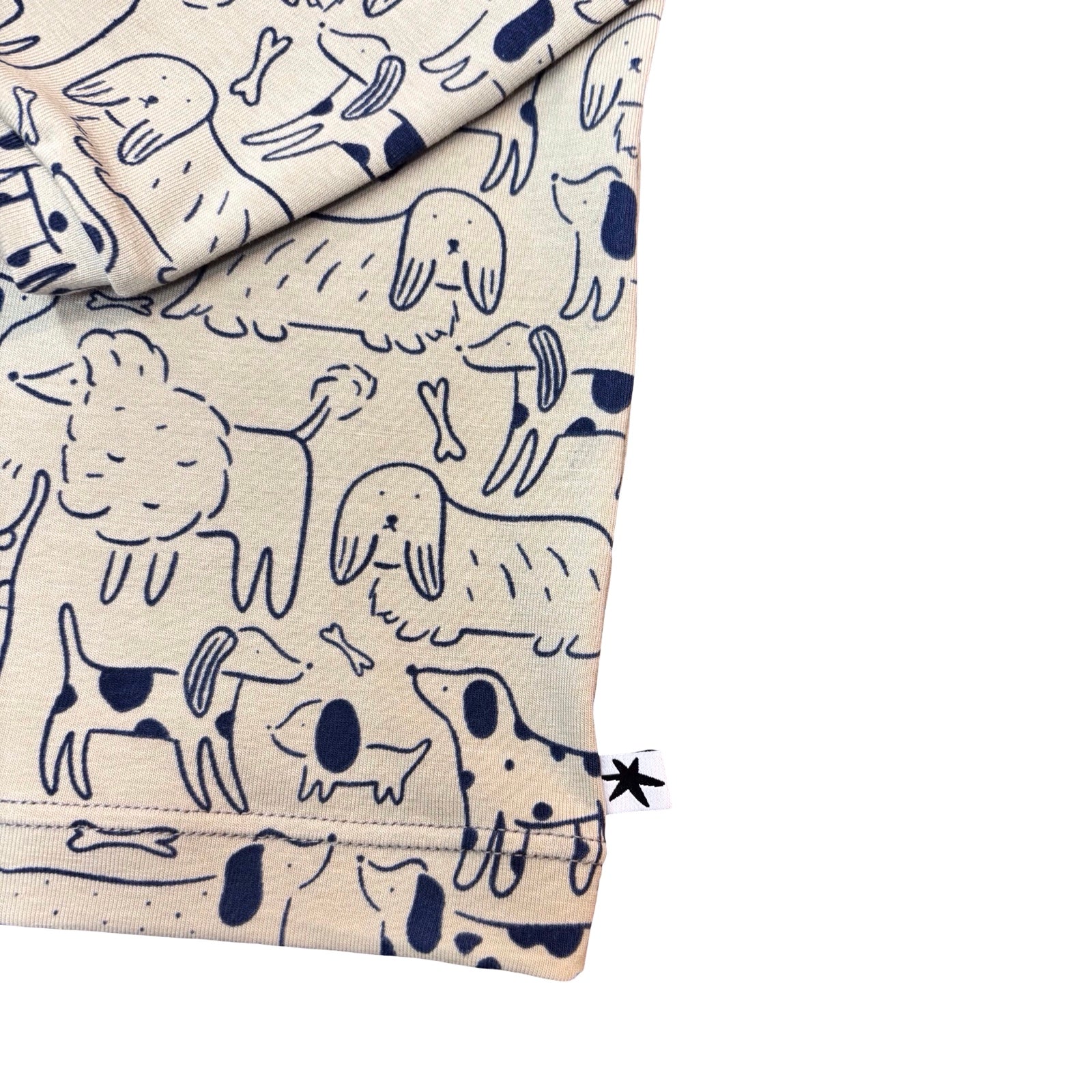 Fabric with navy blue dog pattern on a beige background.